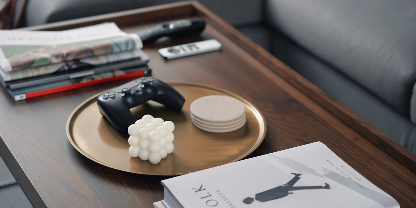 a coffee table with a game controller on it
