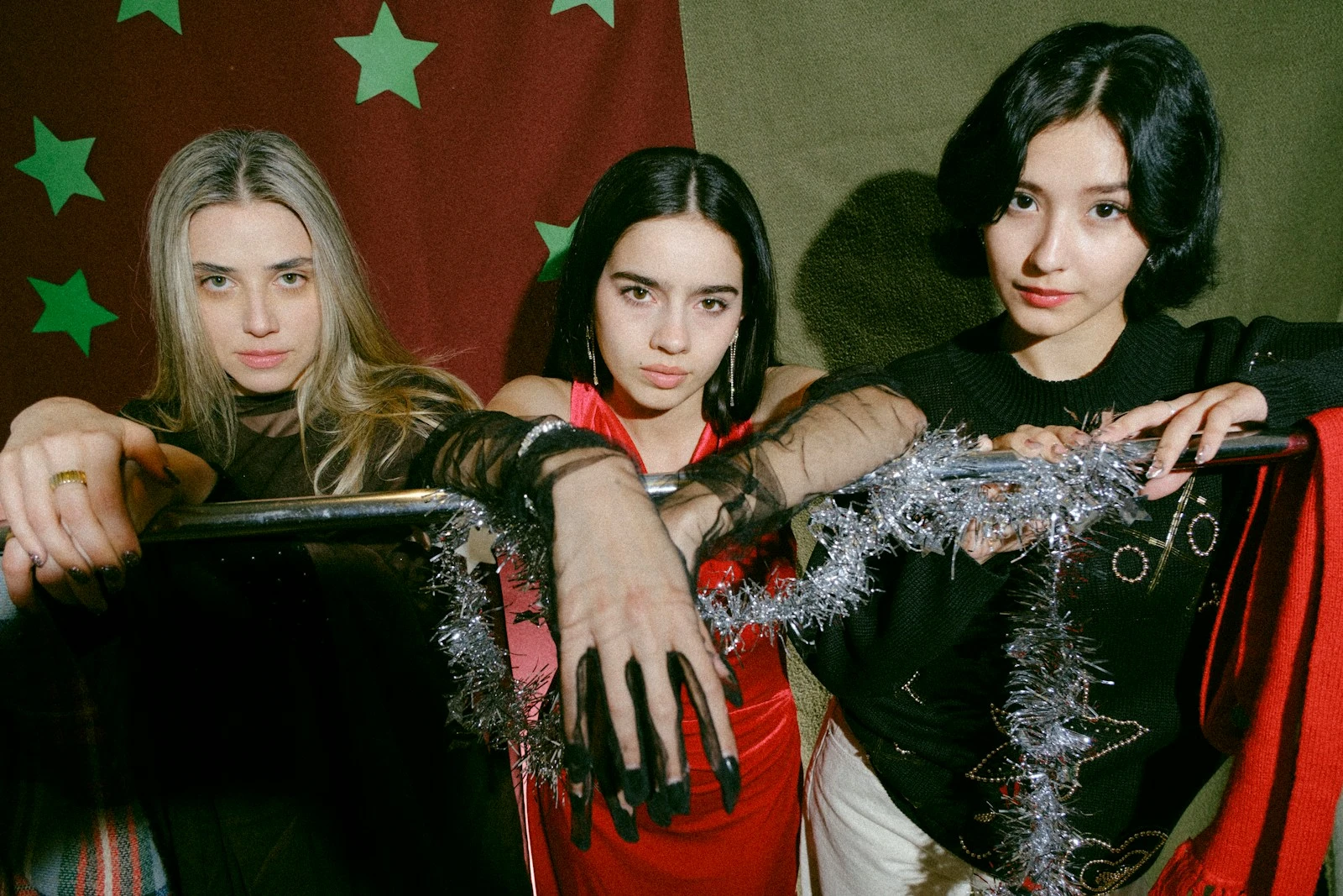 A group of young women standing next to each other