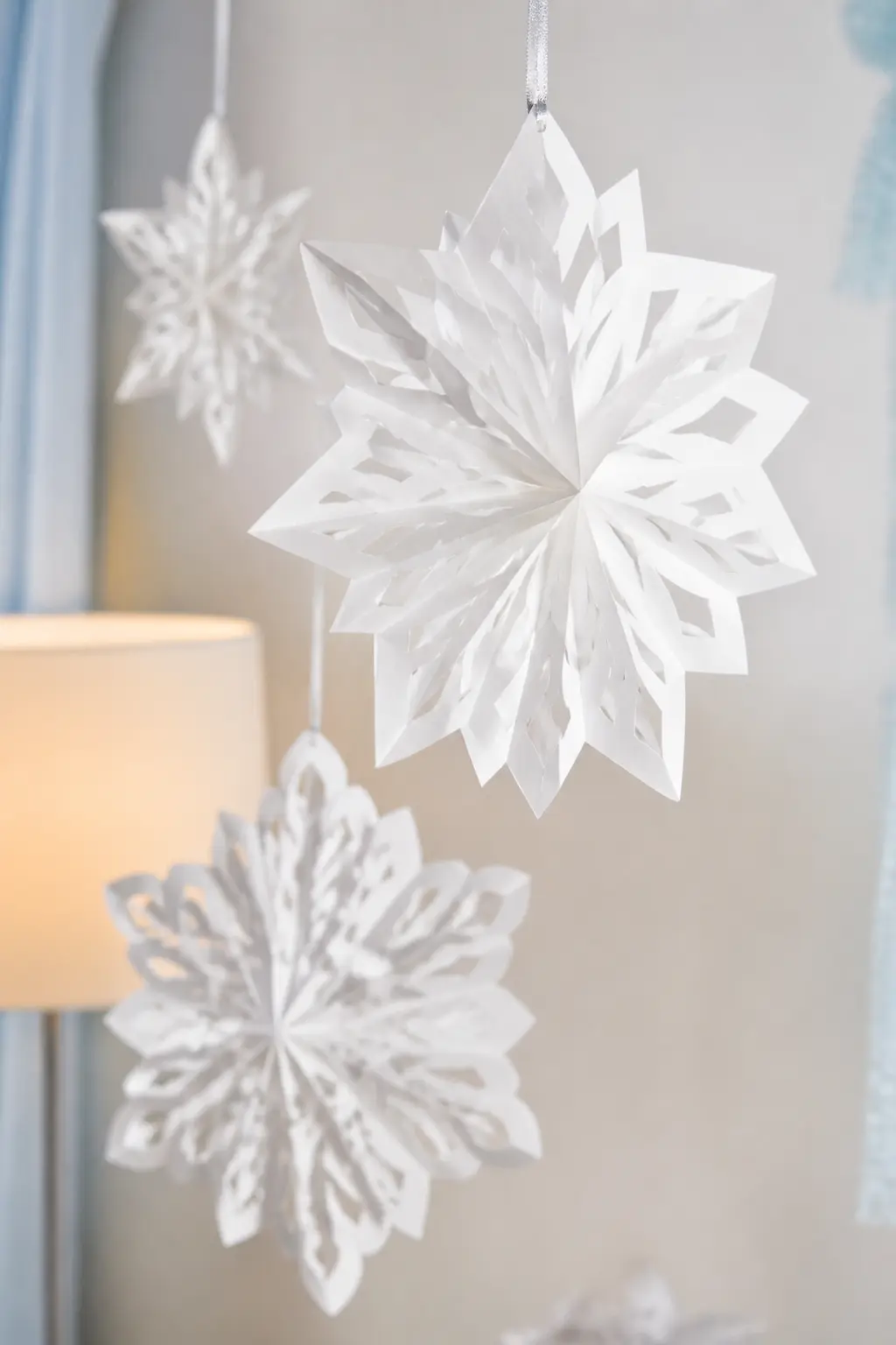Paper Snowflakes Hung at Three Different Heights