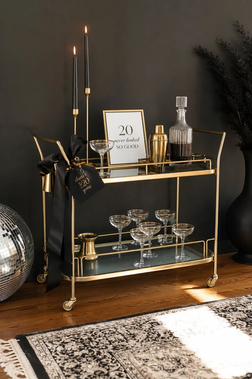 Little Black Dress Cocktail Hour — Black dress code, gold accents, and a bar cart doing the heavy lifting instead of a whole room of decor. 20th birthday themes