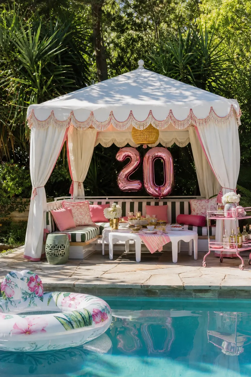 Poolside Cabana Afternoon — A fringe-trimmed cabana beside the water carries the whole look, with striped cushions inside and a floral pool float parked