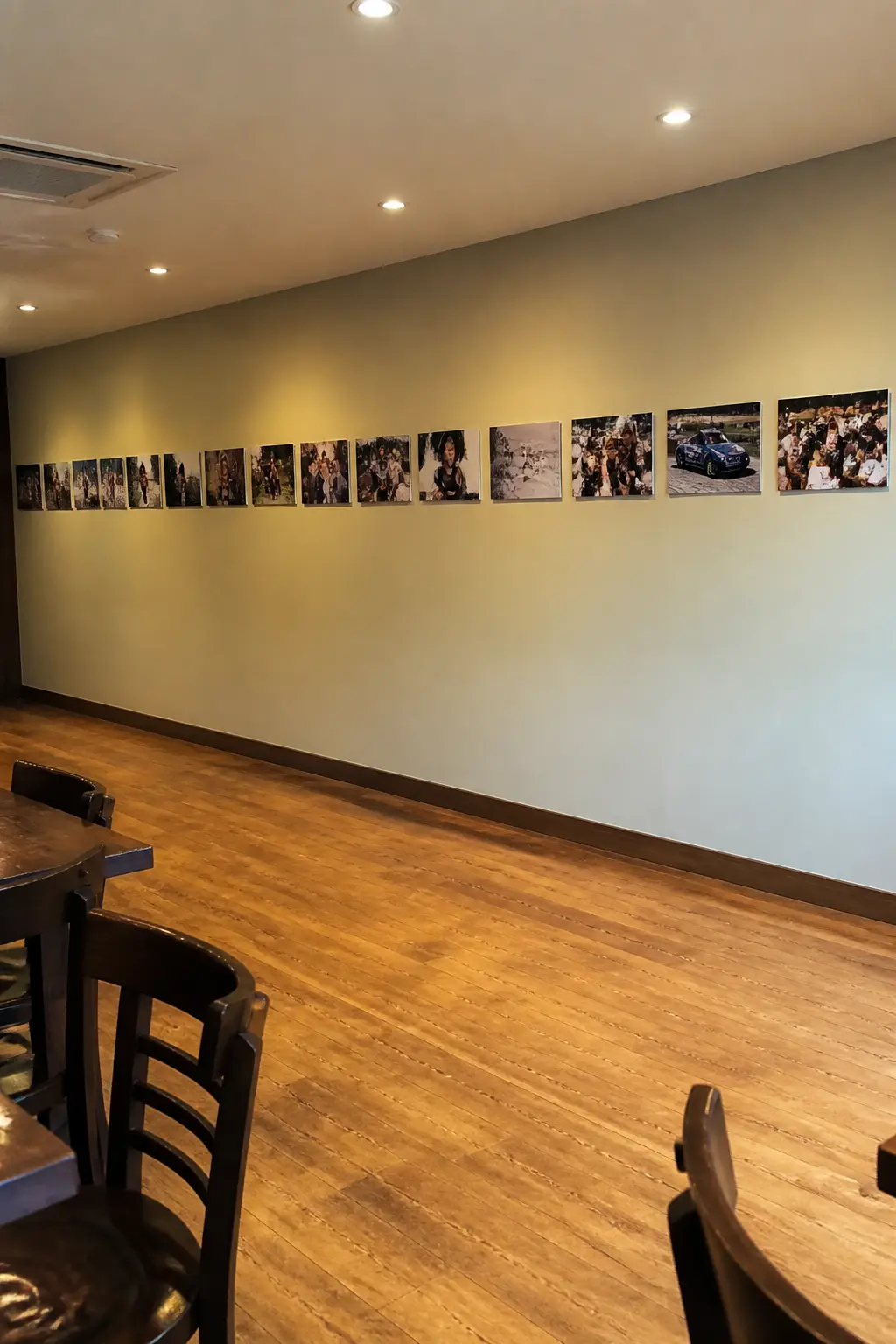 Photographs of Fifty Years Along One Wall