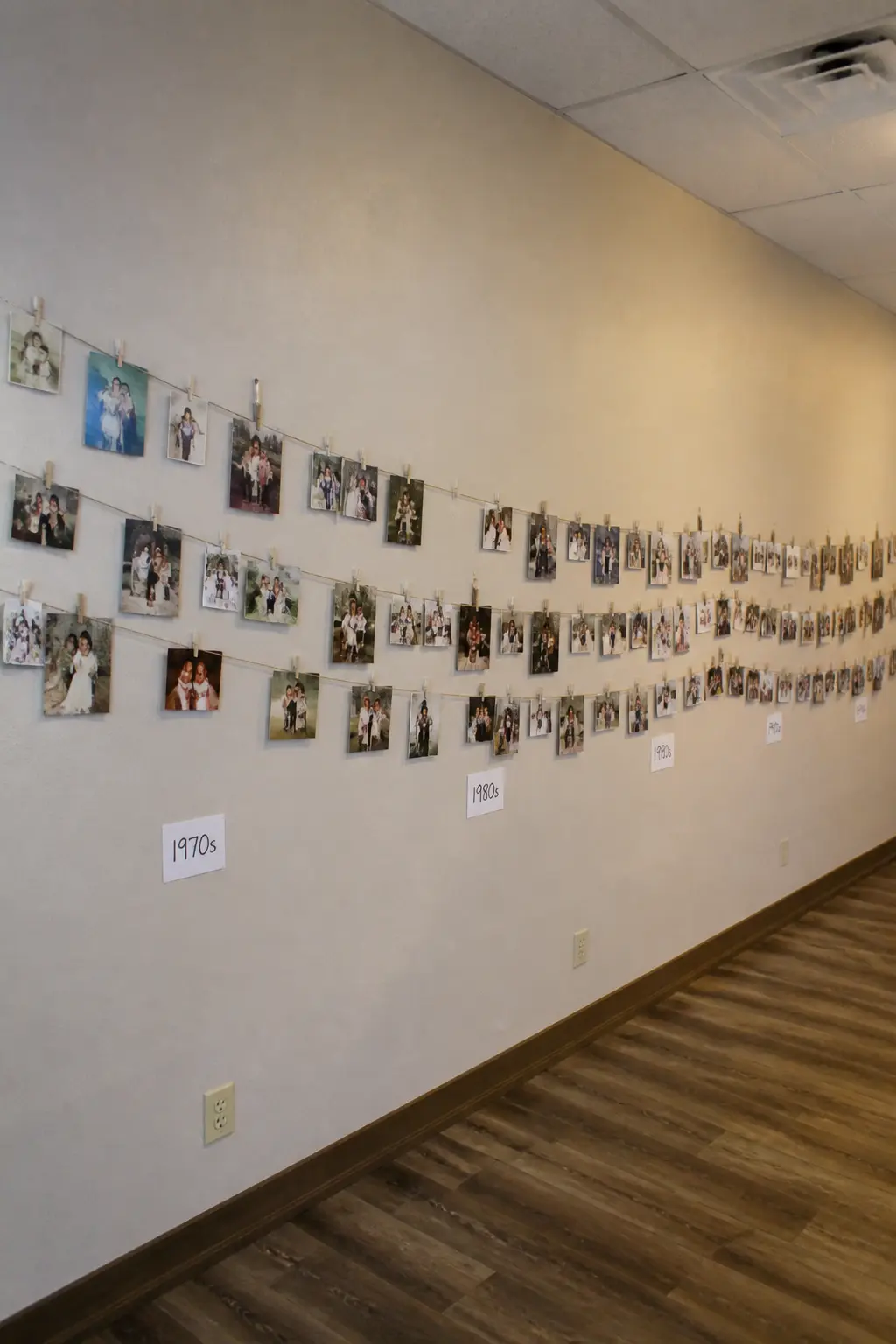 Photographs of Fifty Years Along One Wall