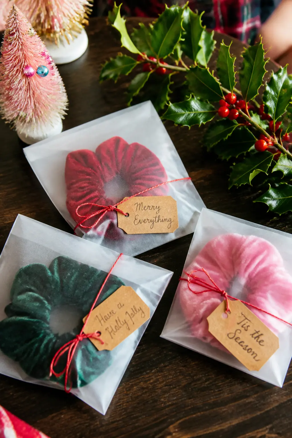 Velvet Scrunchie Party Favour — A velvet scrunchie in red, green, forest, or candy pink, tucked into a small glassine bag with a handwritten tag, is a party