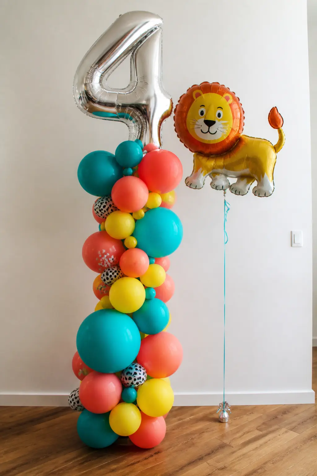 Foil Balloon Number and Animal Cluster — A large foil number balloon in the child's age, flanked by a cluster of latex in the party colours and two or three