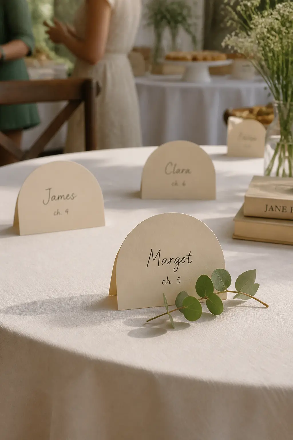 Open-Book Place Card Holder — Fold a small rectangle of cream cardstock in half and cut a gentle arch at the top so it resembles the silhouette of an open book