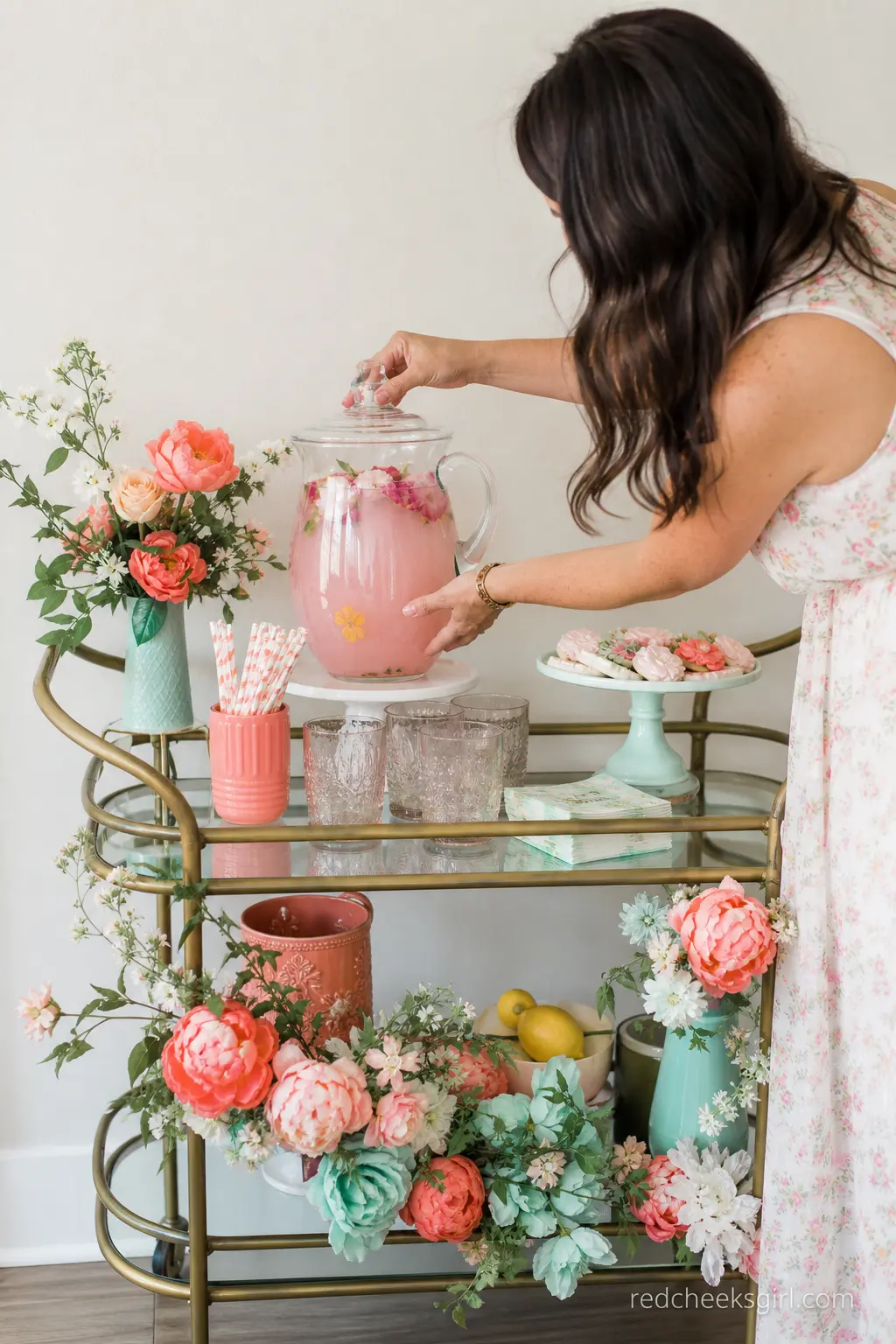 Coral and Seafoam Flower Cart Drink Station — A small vintage style cart or bar table dressed in coral and seafoam, holding a pitcher of rosewater lemonade and