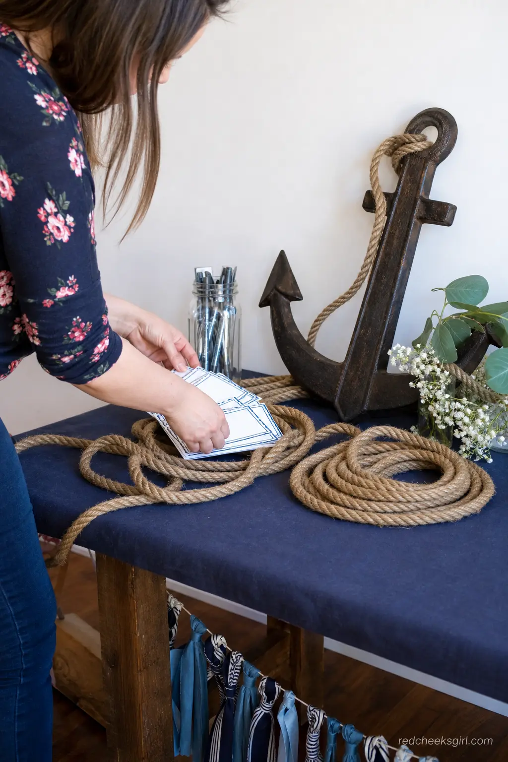 Anchor and Rope Guest Table — Somewhere near the door, guests need a place to sign a card or leave a wish, and an anchor makes a sturdier centerpiece for that