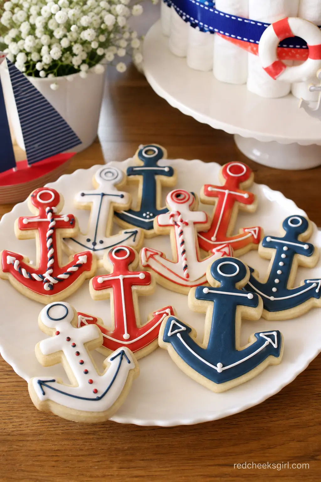 Anchor Sugar Cookies — Anchor shaped cookies iced in red, navy and white travel well as a grab-and-go favor and photograph beautifully stacked on a single