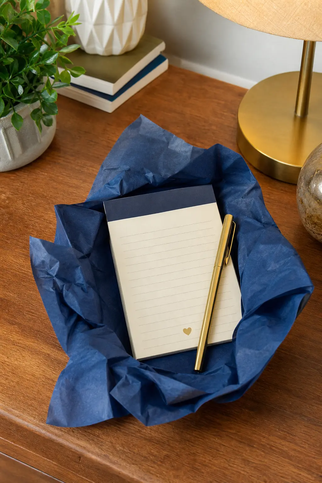 Brass Pen and Notepad Set — A weighty brass pen paired with a small lined notepad feels like an upgrade from the free hotel pen everyone actually uses, and it