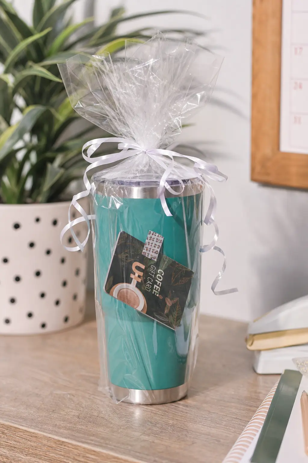 Insulated Travel Tumbler with a Coffee Gift Card — An insulated tumbler is the one prize that gets used the very next morning, and taping a small coffee shop