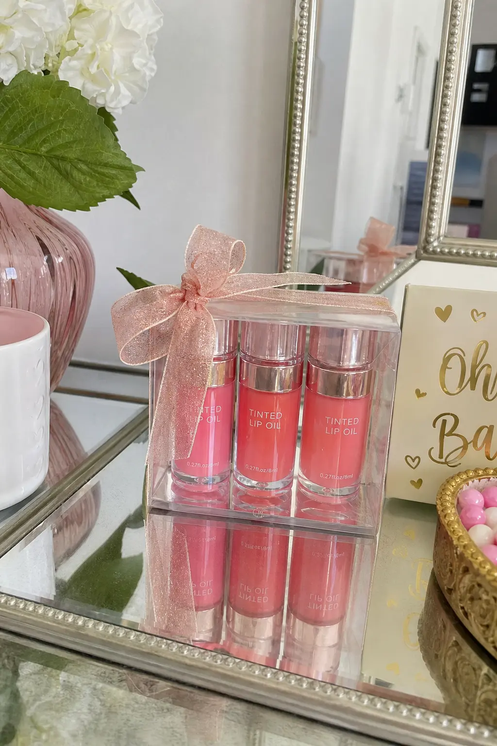 Tinted Lip Oil Trio — Three tinted lip oils in different shades cost less together than one department store gloss and give a teenager real choice instead of a