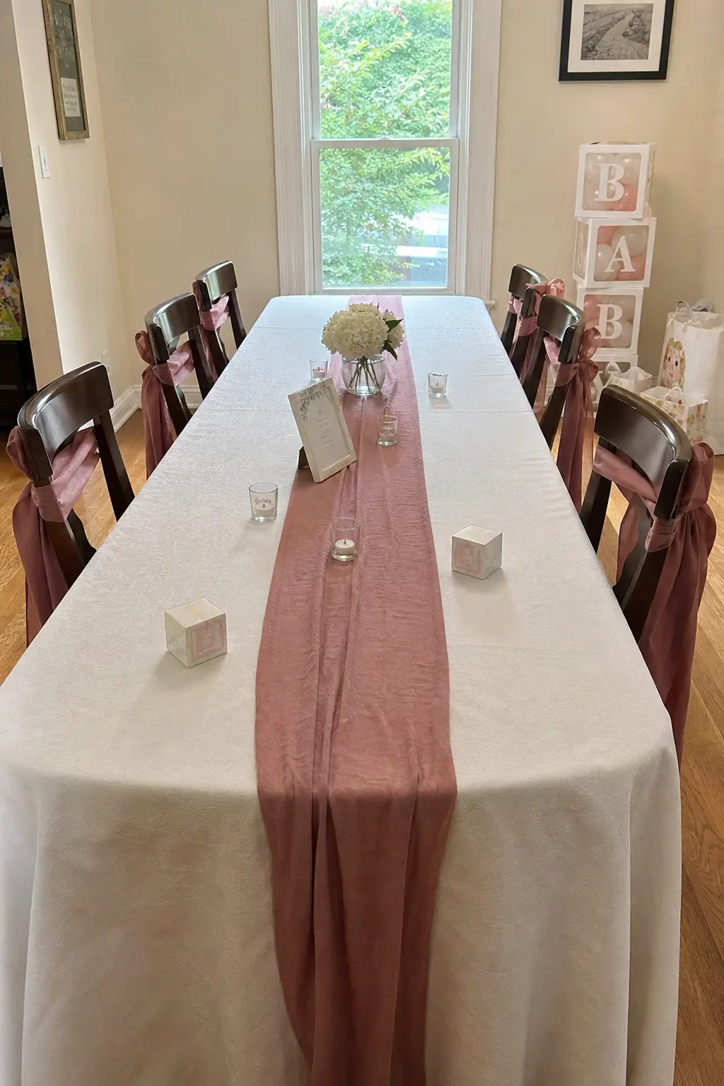 A Length of Ribbon Run the Table, Tied at Each Chair