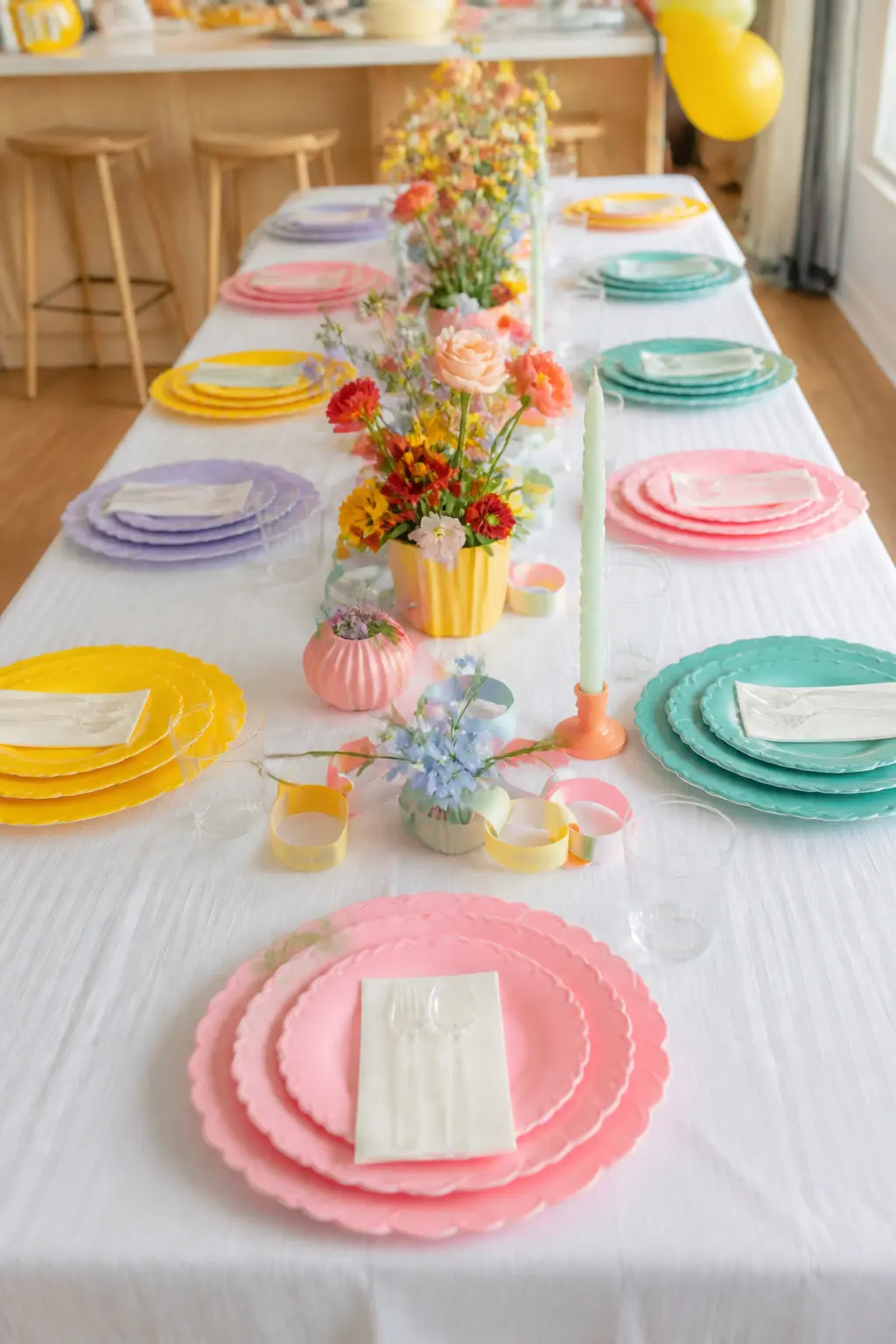 Layered Scallop Plate Place Setting — Stack three plates at each seat: a large scalloped dinner plate in one colour, a smaller scalloped salad plate in a
