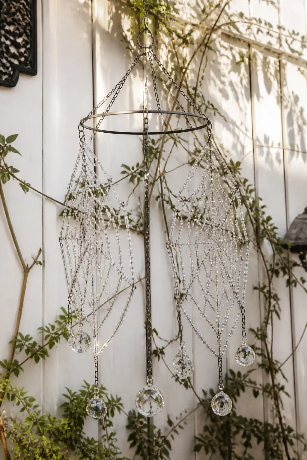 Clear Crystal Dowel Suncatcher — Three webs hang from a single stained walnut dowel on thin silver chain, each worked in size-11 clear AB seed beads on