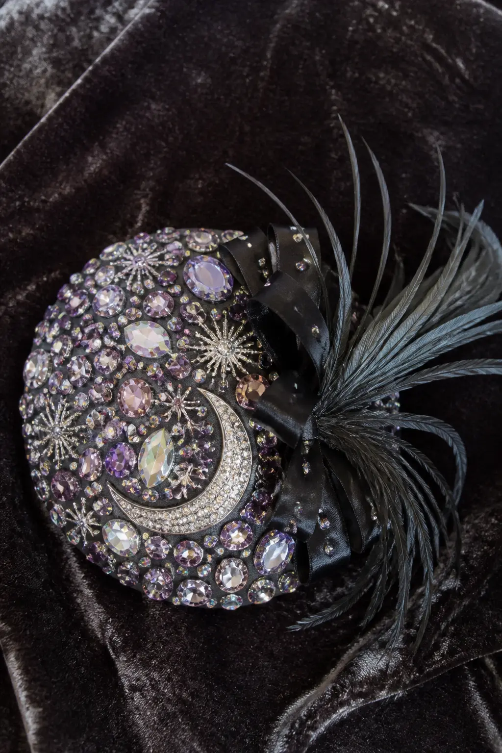 Gem-Encrusted Party Fascinator — A plain black felt or satin fascinator base, the kind with a small comb or clip, transforms into a full Halloween accessory