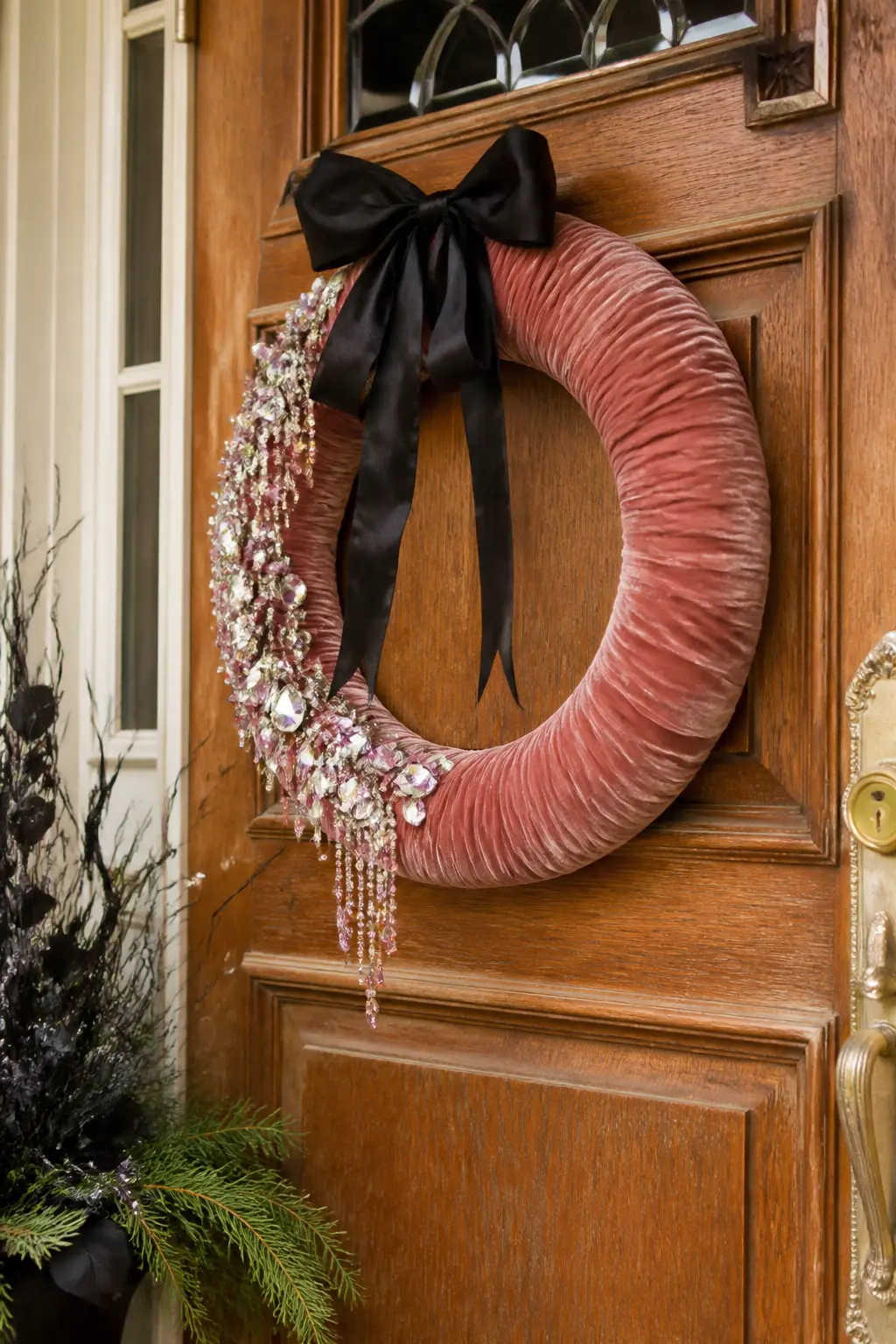 Velvet Ribbon and Gem Wreath — Wrap a grapevine wreath completely in narrow dusty rose velvet ribbon before adding a single waterfall of rhinestones down one