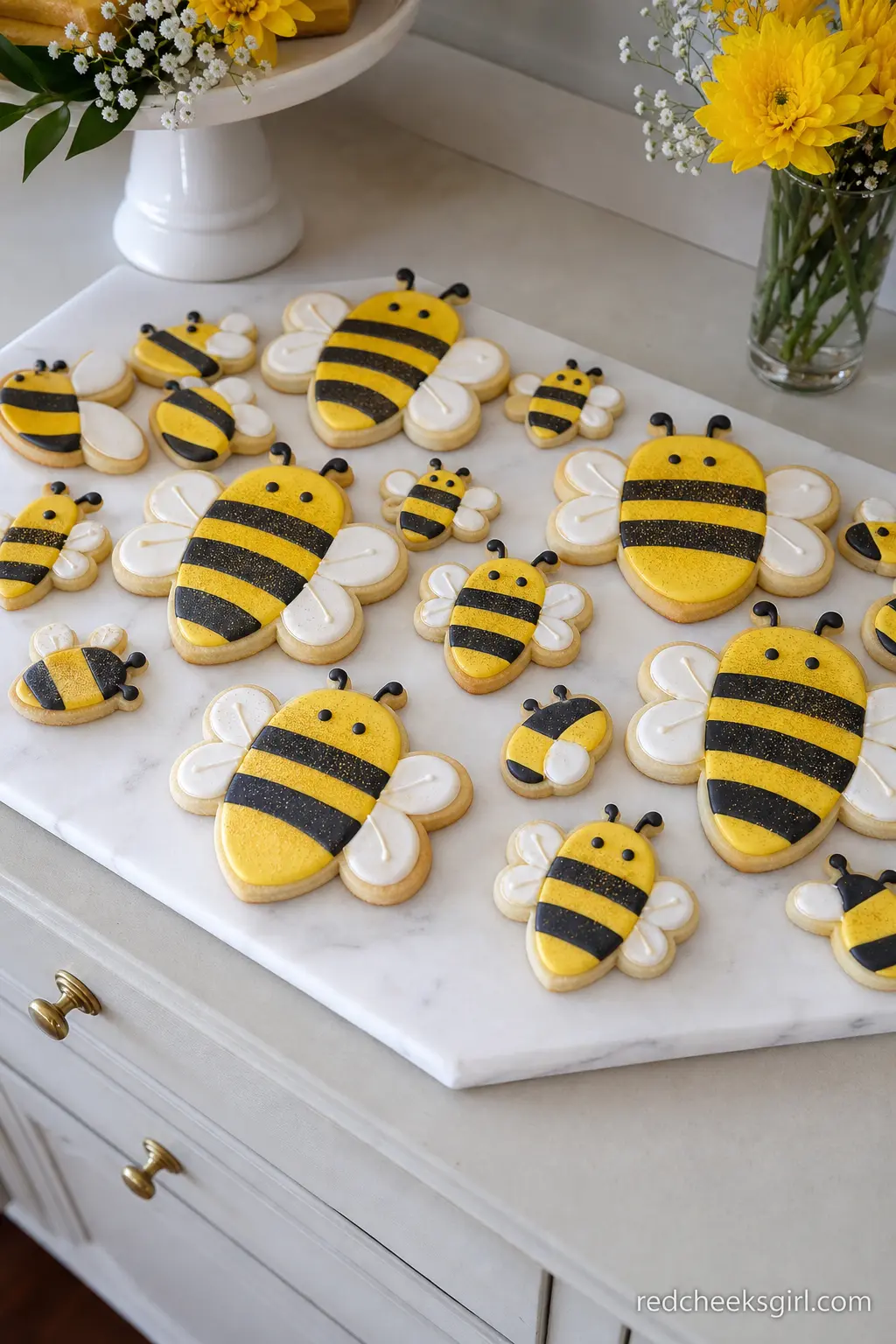 Bee Striped Cookie Platter — Iced cookies in black and yellow stripes fill in the gaps a cake and a donut tower leave behind, and they travel well if guests