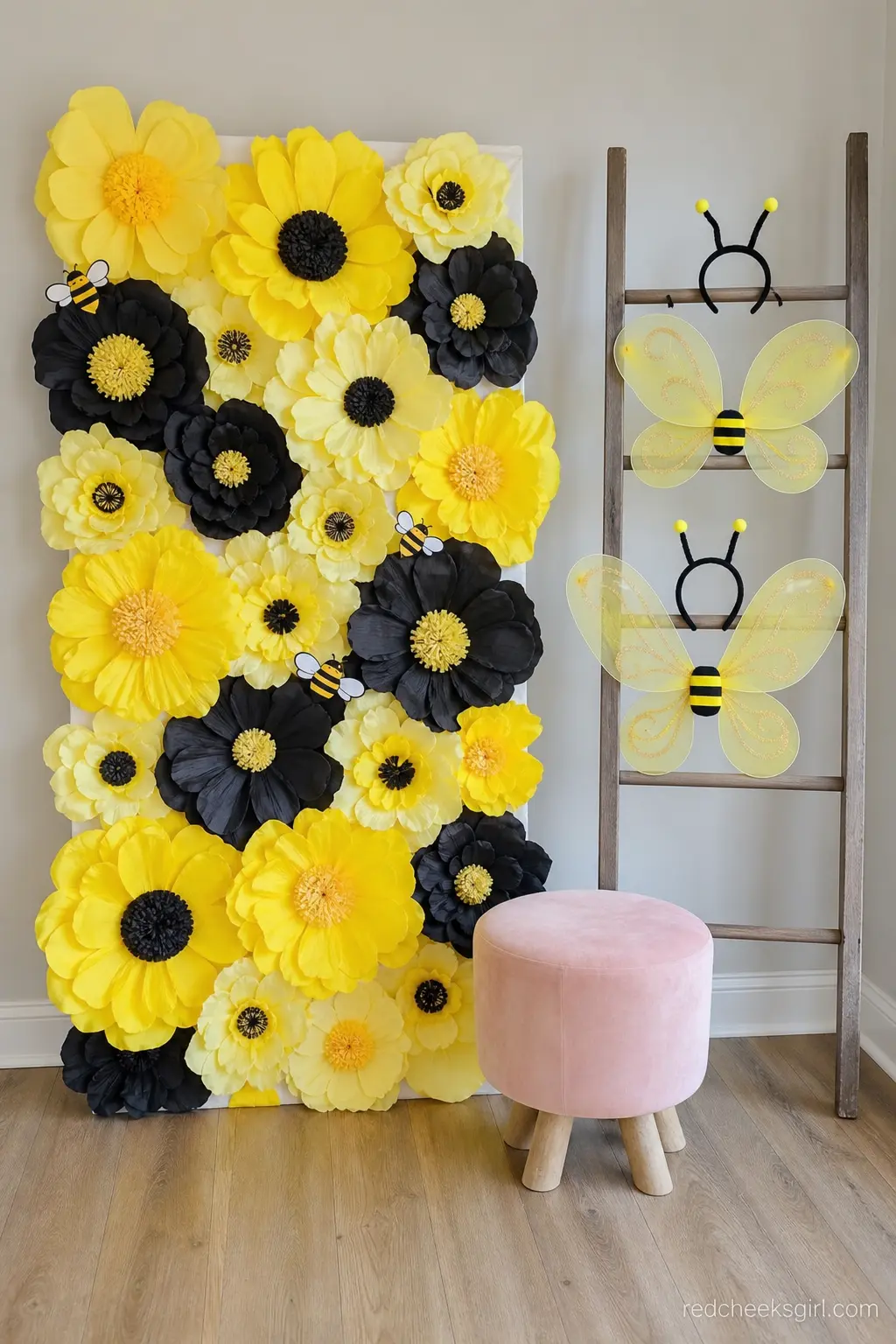 Bee Wings Photo Corner — A small photo corner gives guests somewhere to take a picture that is not the gift pile, and props on a rack mean nobody has to dig