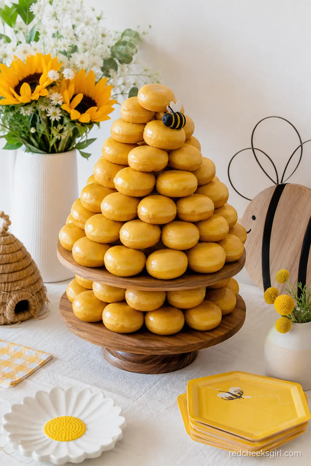 Beehive Donut Tower — Stacked donuts in a rounded shape make a beehive without anyone touching an oven. Bee baby shower theme