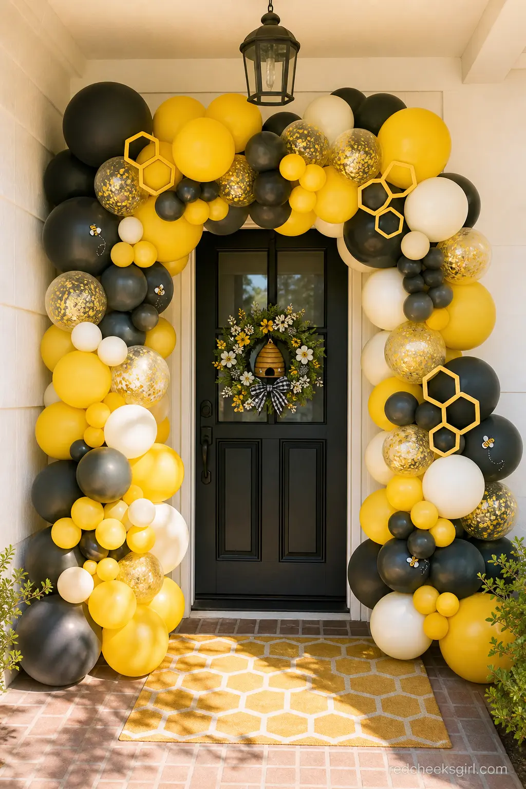 Honeycomb Balloon Arch at the Entryway — An organic balloon arch over the front door does more for the theme than almost anything else on this list, purely