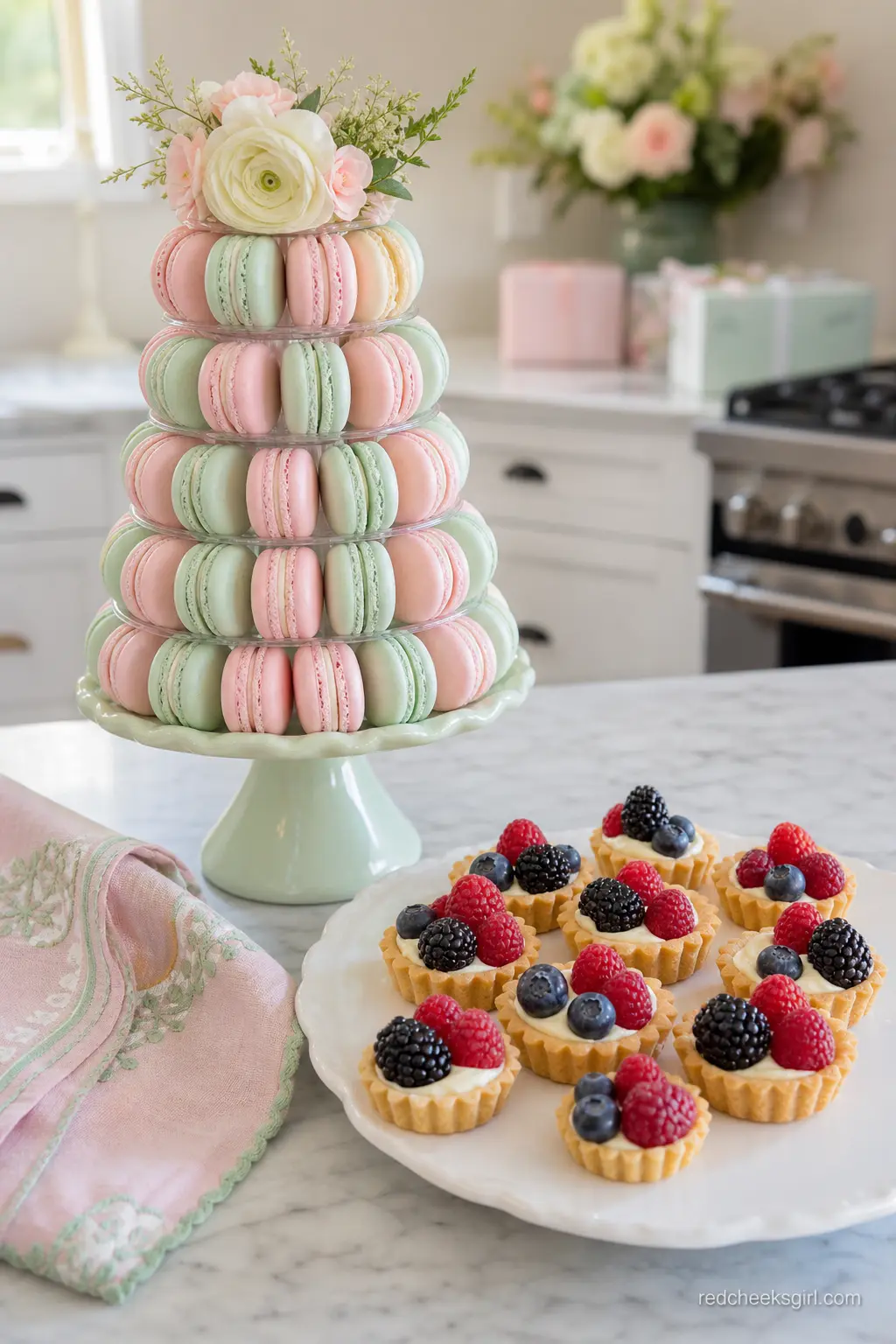 Pastel Macaron and Berry Tart Tower — For a softer, more grown-up palette, build a pastel pink and mint macaron tower beside a stack of small berry tarts.