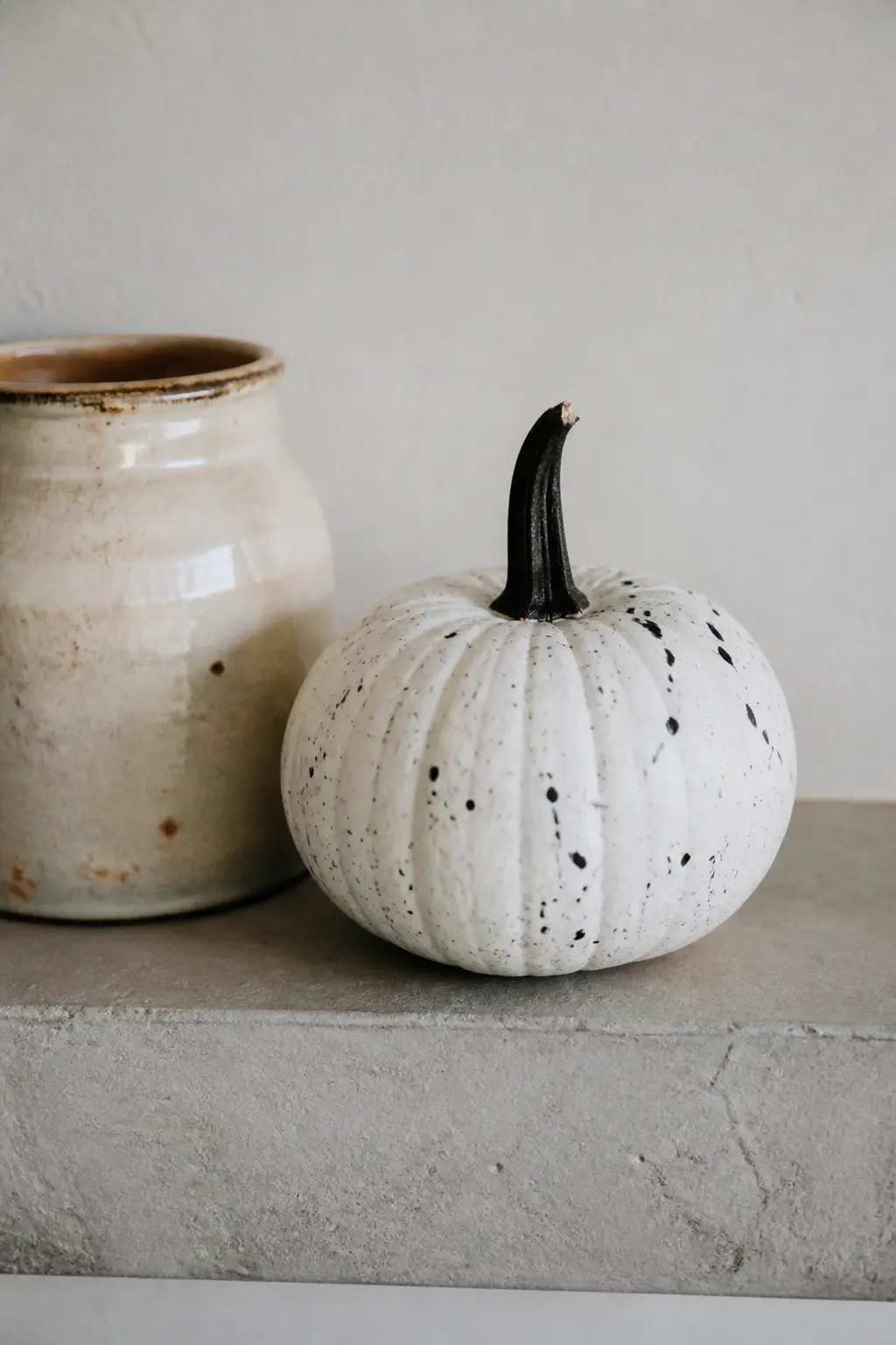 Speckled from a Flicked Brush — Base coat in white. Black and white painted pumpkin