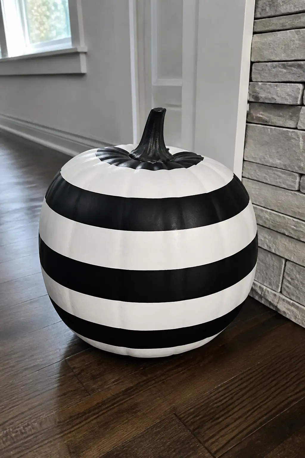 Thick Alternating Bands — Tape off bands roughly four centimetres wide using painter's tape, alternating the sections you leave exposed. Black and white