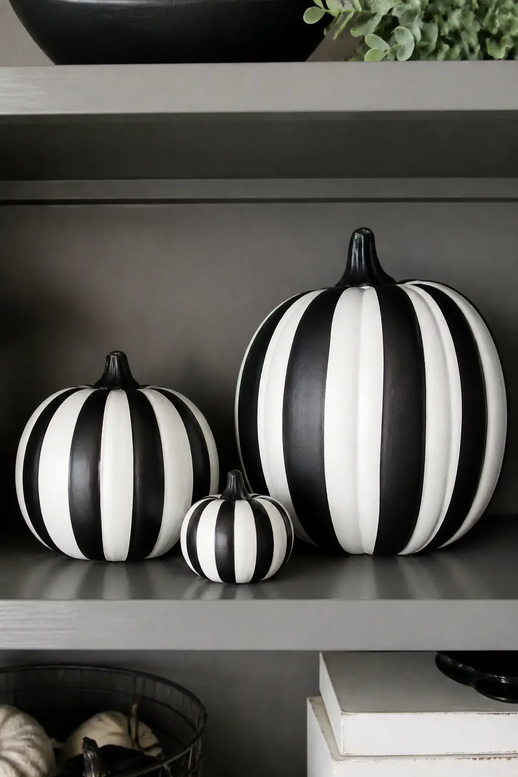Three Sizes All in the Same Pattern — Choose one pattern, stripes, polka dots or checkerboard, and paint it onto three pumpkins in small, medium and large.