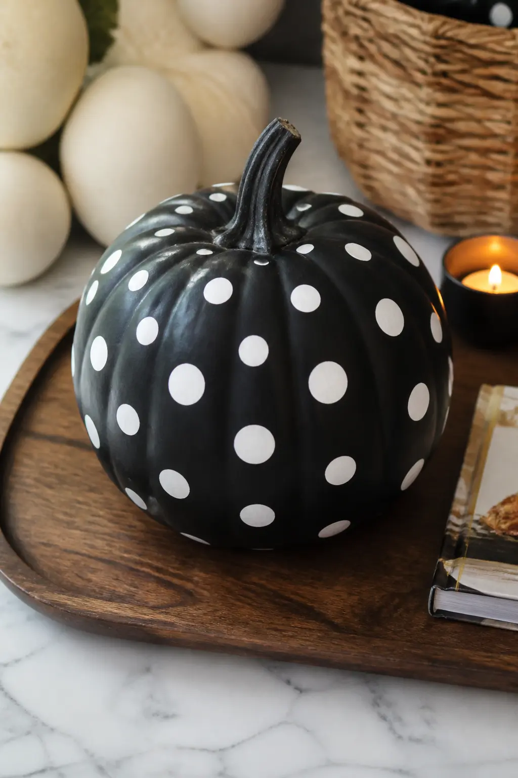 White Dots on a Matte Black Body — Base coat in matte black. Black and white painted pumpkin