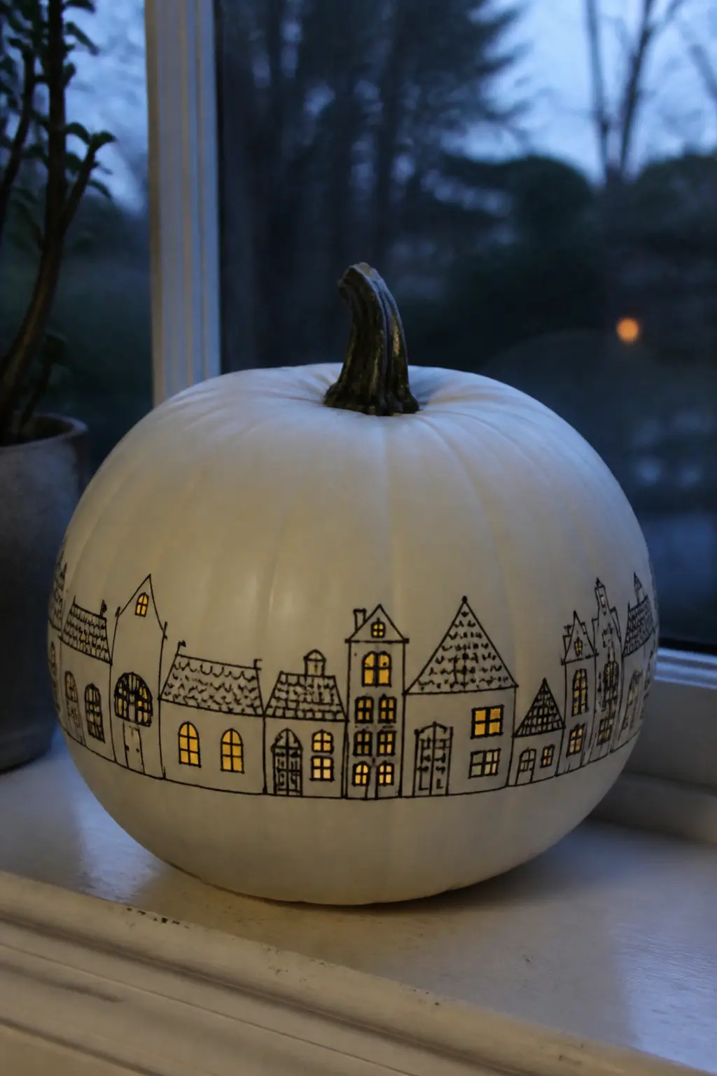 A Whole Village of Houses with Lit Windows — Base coat in white. Black and white painted pumpkin