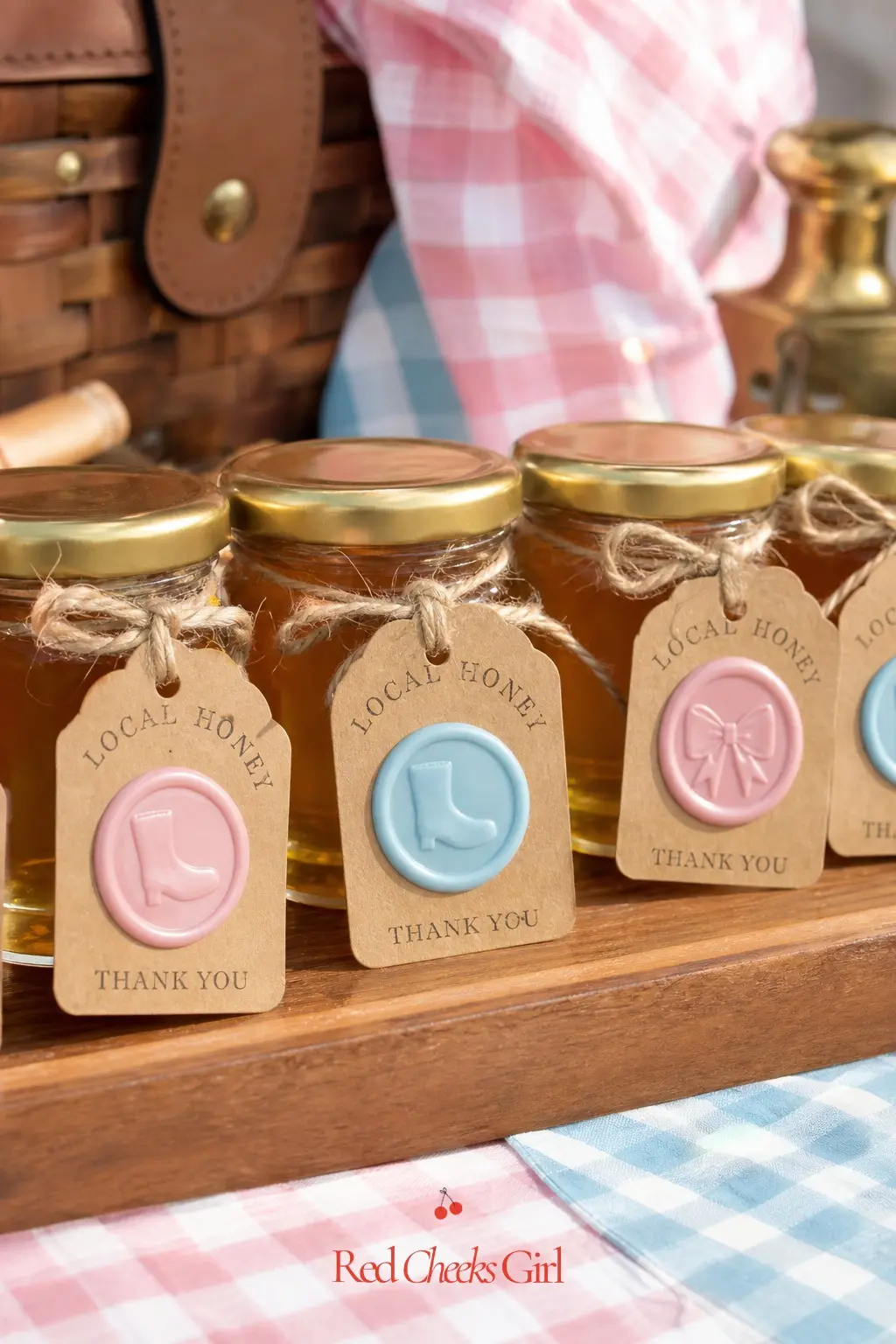 Local Honey Jars With A Wax Seal — Small jars of local honey, each finished with a round kraft tag and a wax seal stamped with a tiny boot or bow, line up on a
