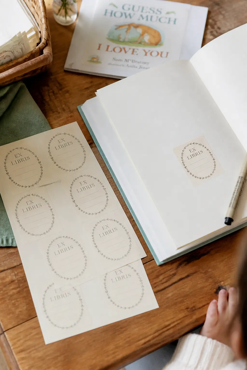 The Ex-Libris Bookplate Sticker — A peel-and-stick bookplate on the first page gives guests a defined space to write in, which reduces the chance of a