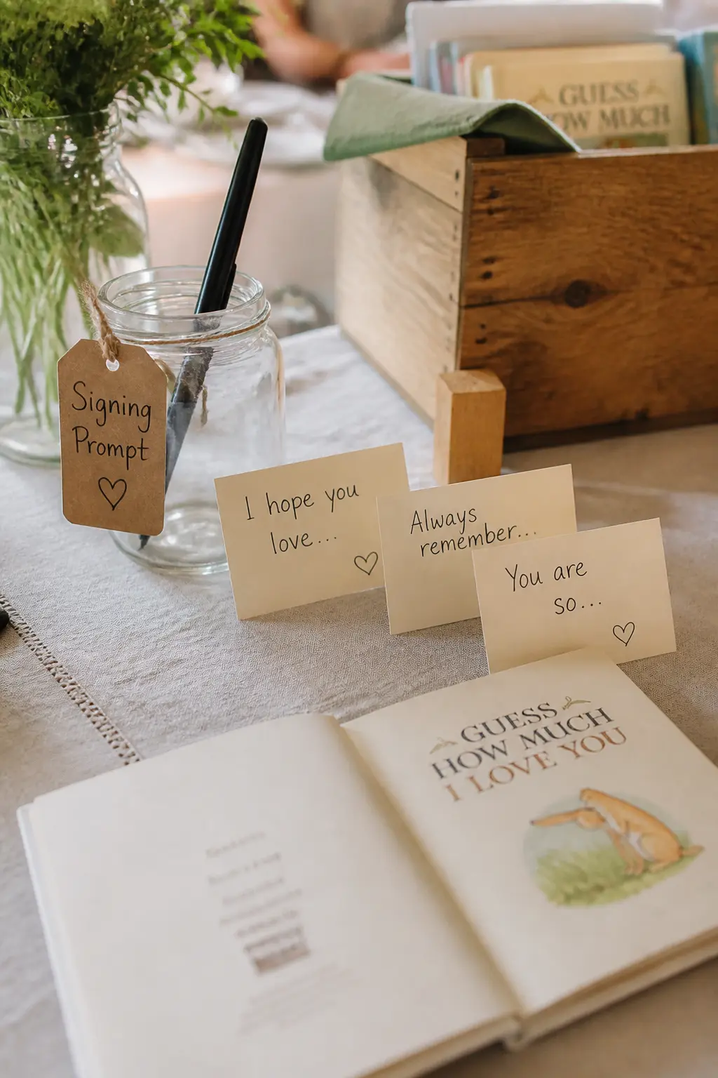 The Signing Prompt Card — A small card propped against the pen jar with a one-line prompt removes the blank-page freeze. Bring a book baby shower ideas