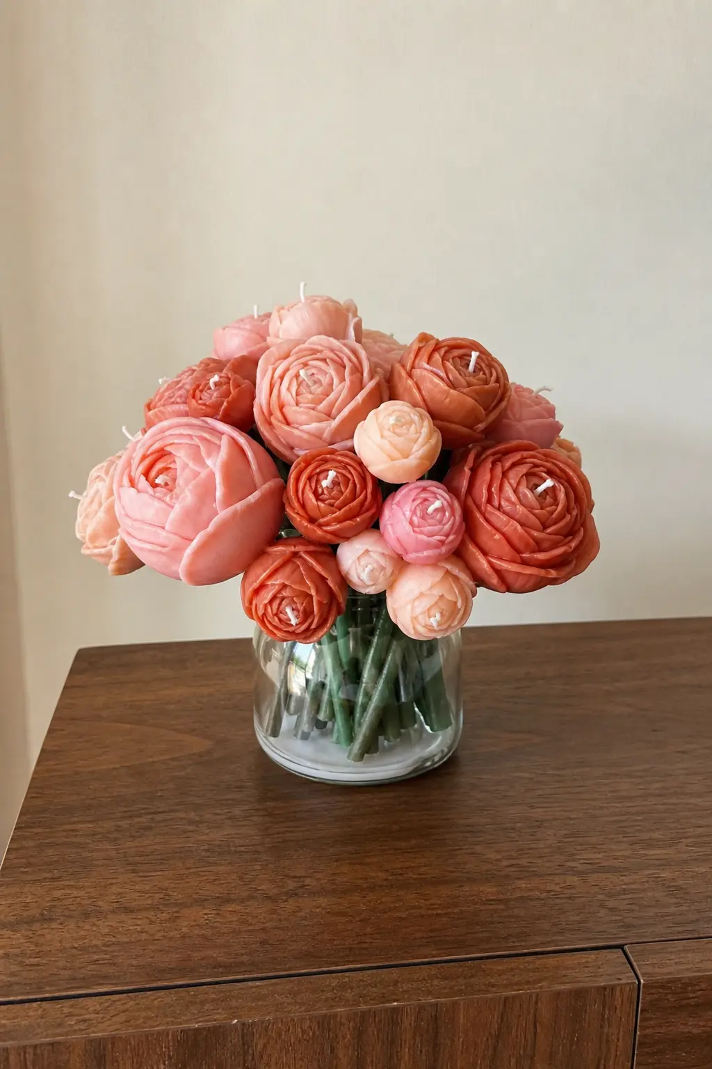 Bloom & Wick Birthday Bouquet — Ranunculus-shaped candles in blush pink and terracotta, poured six to a bouquet and wired onto floral stems so they sit in a