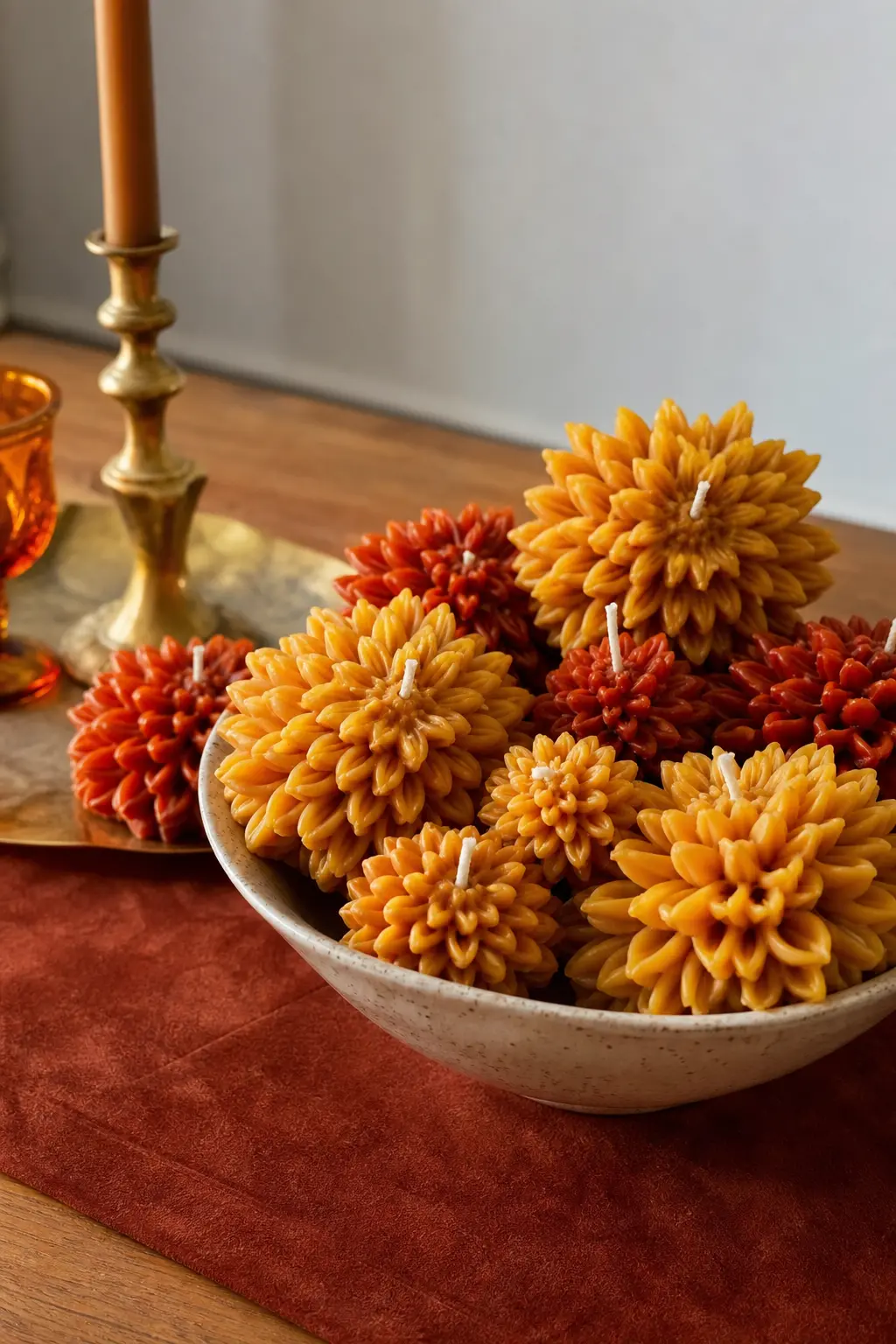 Golden Hour Petals — Dahlia and marigold shapes in mustard yellow and rust, the kind of palette that photographs warm no matter the light. Candle bouquet
