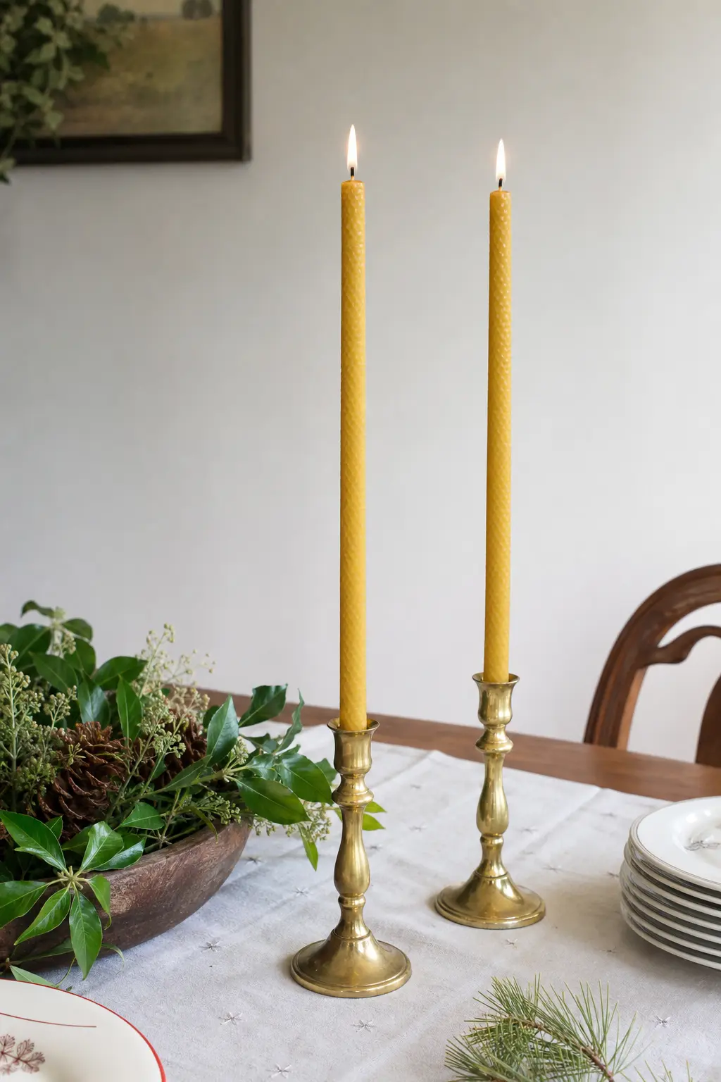 Classic Beeswax Taper Pair — A pair of natural gold beeswax tapers, hand-dipped rather than extruded, has a slightly imperfect taper that looks better in brass