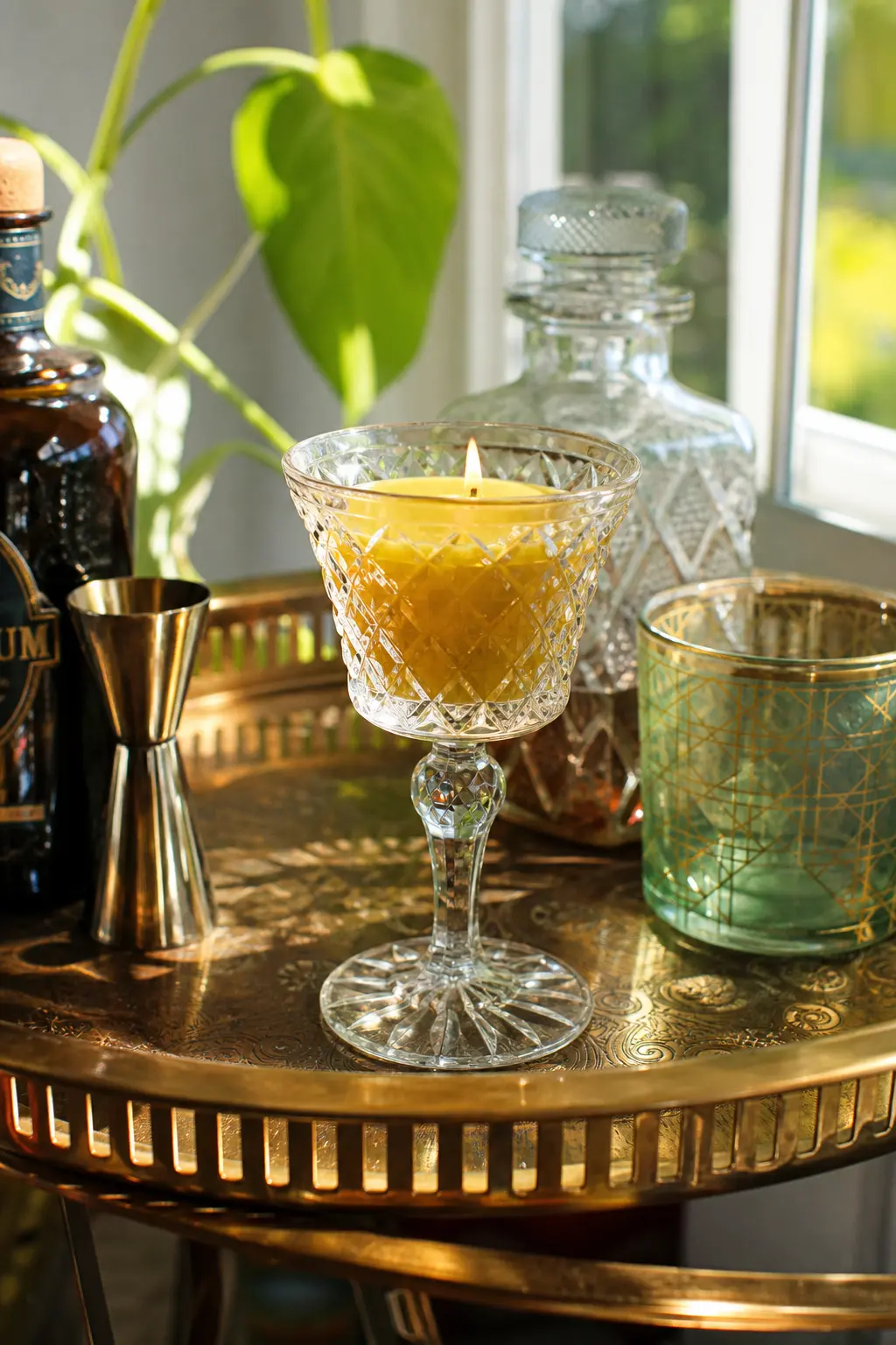Cut-Glass Sherry Glass Candle — A single cut-glass sherry or cordial glass, orphaned from its set, throws light beautifully once a honey gold candle sits