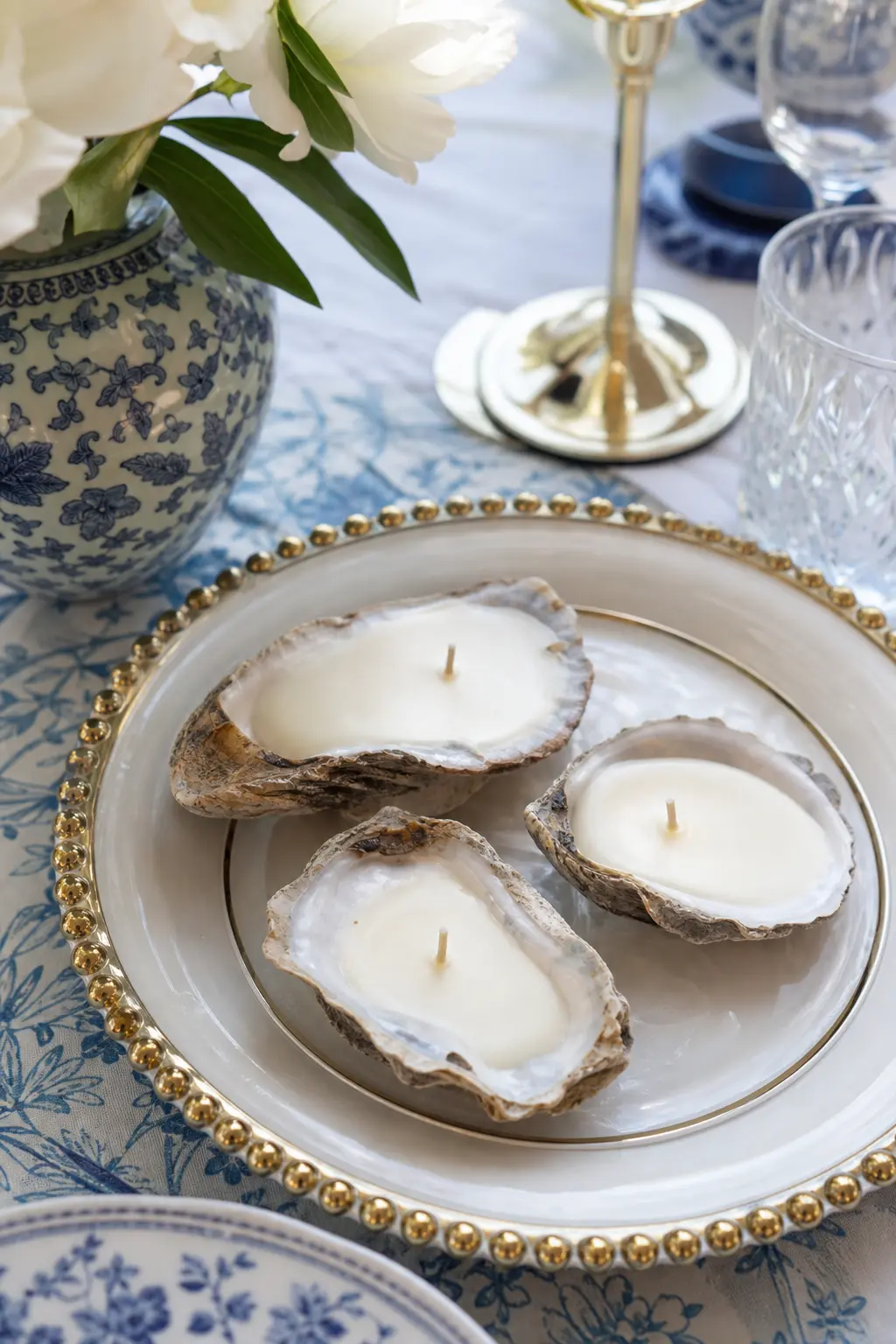 Oyster Shell Mini Trio — Three tiny pearl white candles nestled into oyster shells make an elegant place setting detail, small enough to sit beside a napkin