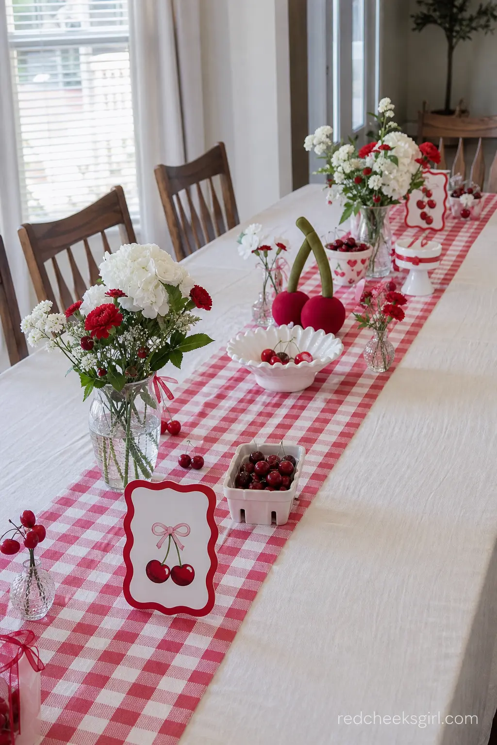 Red Gingham Table Runner Setting — Take your cherry theme to the next level using red and white checkered fabric for a picnic feel. Cherry on top baby shower