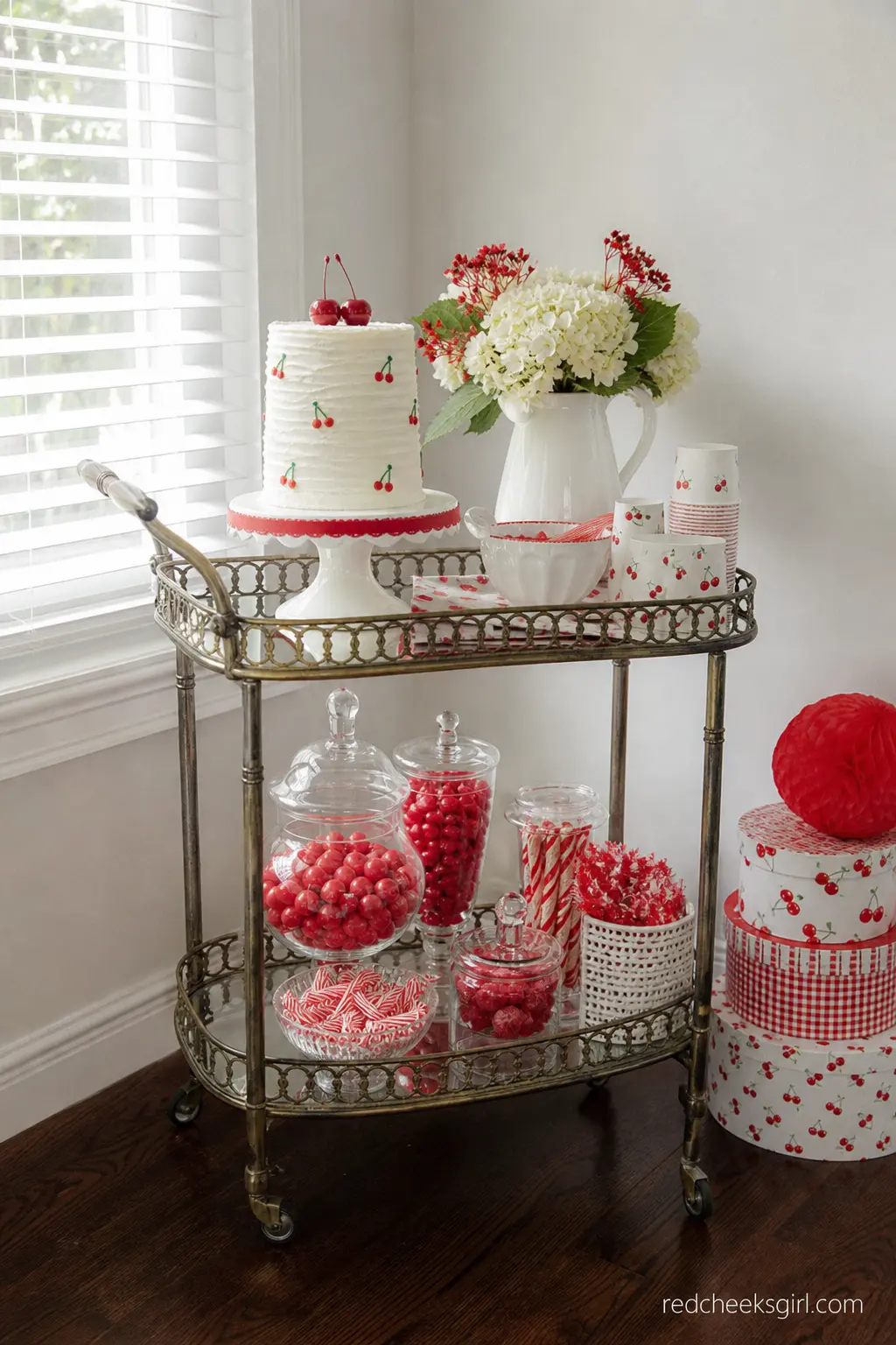 Vintage Cart Cherry Dessert Display — A small vintage-style cart stacked with cherry treats works well in a corner that would otherwise sit empty, and it frees