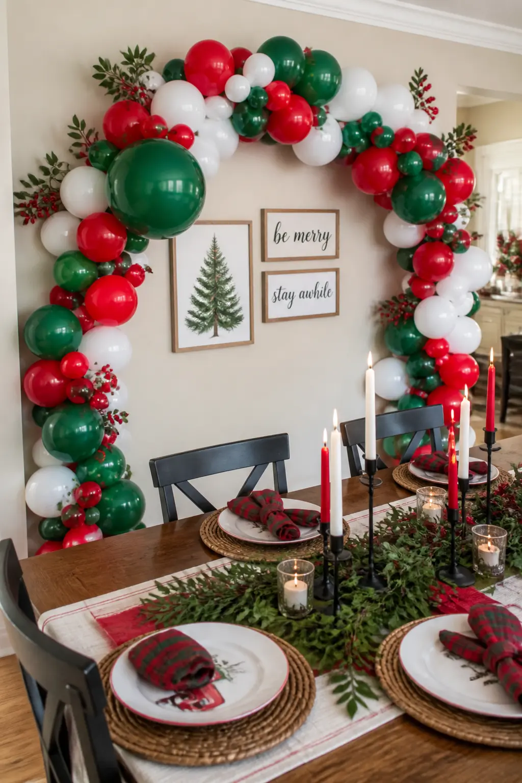The Seated-Dinner Statement Wall Arch — A full arch spans the width of the dining room wall behind the head of the table. Christmas balloon arch