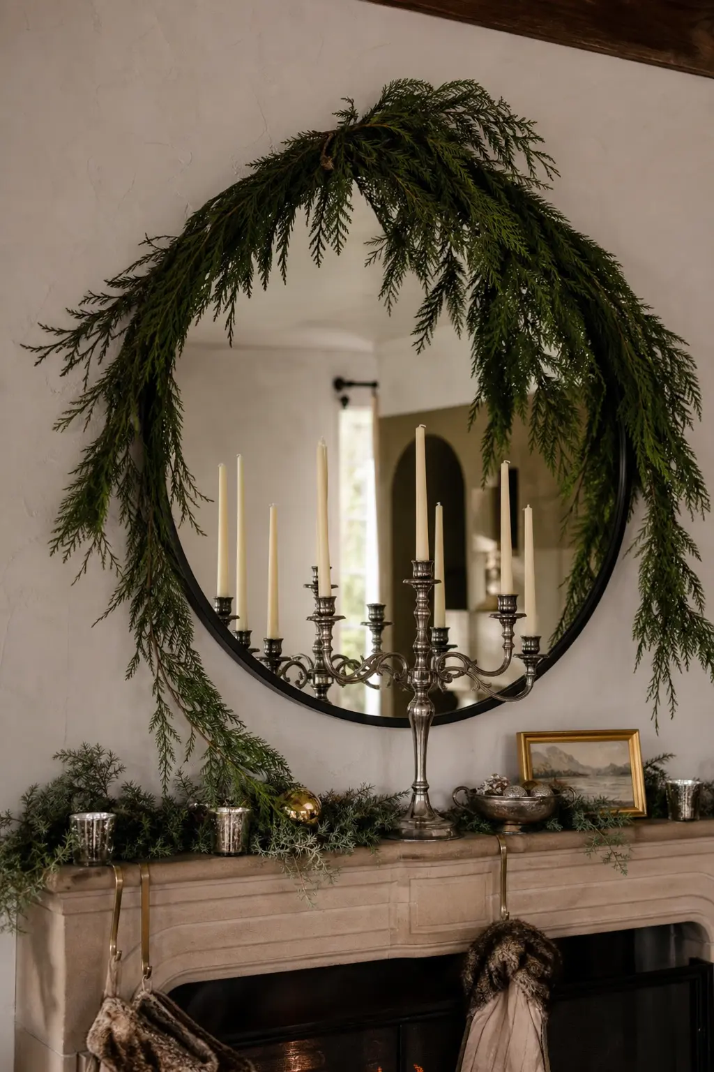 A Bare Metal Candelabra With Foliage on the Wall Behind