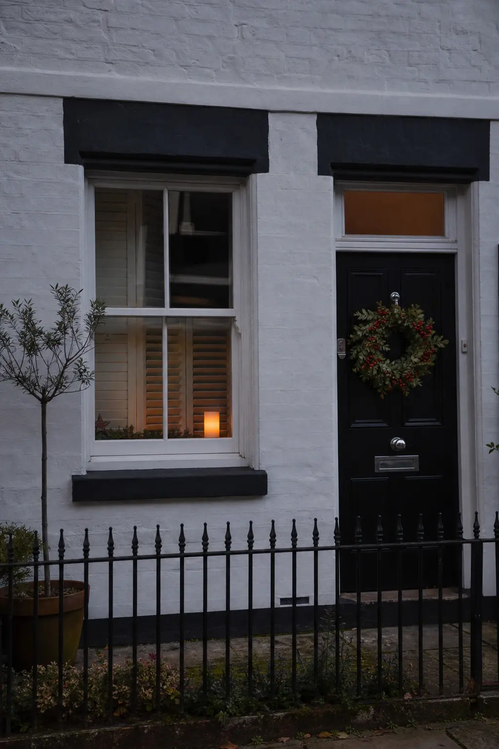 Candle in the Window Beside the Door