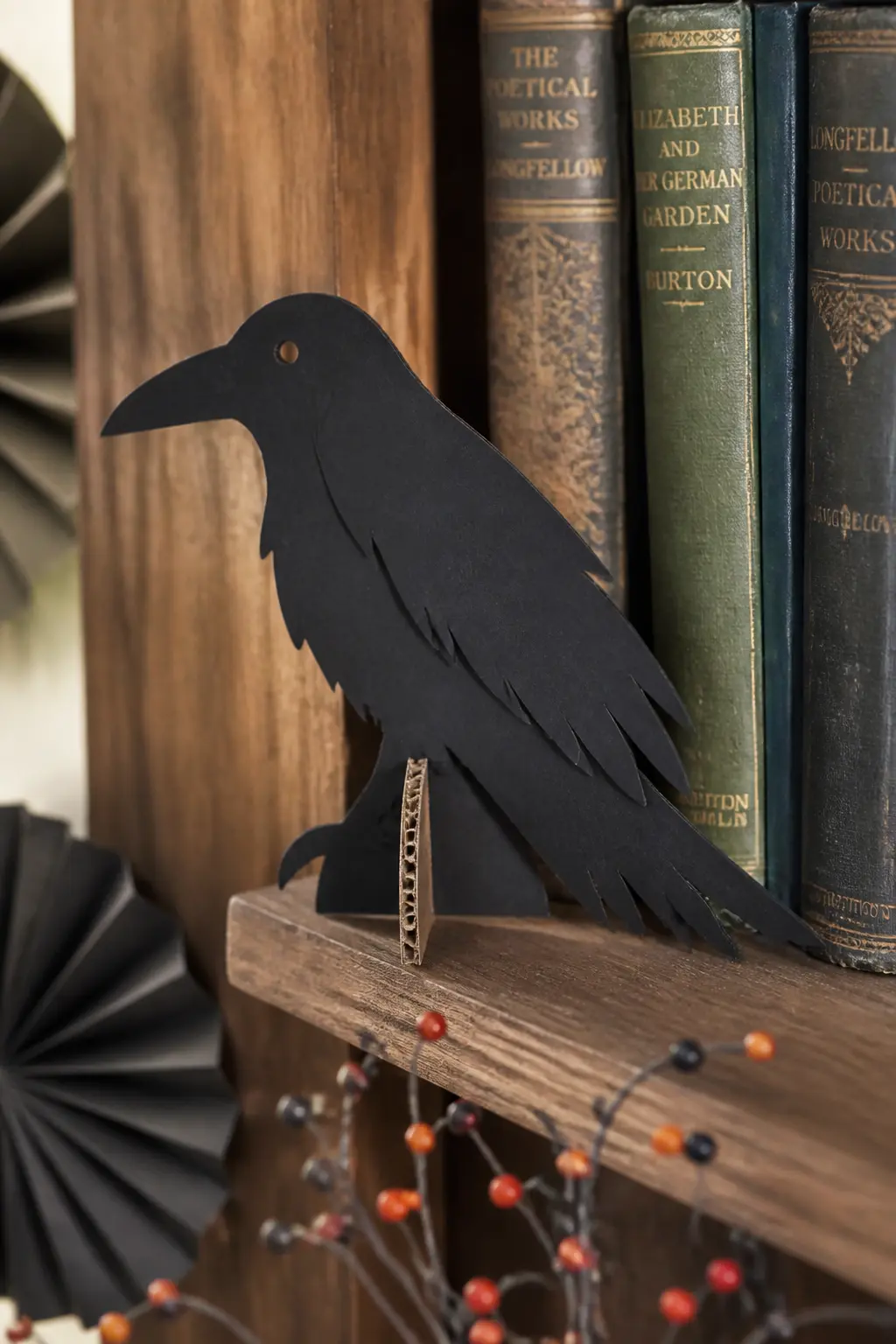 Cardboard Crow Shelf Sitter — Cut two identical crow silhouettes from black card stock and glue them back to back over a strip of corrugated board bent into a