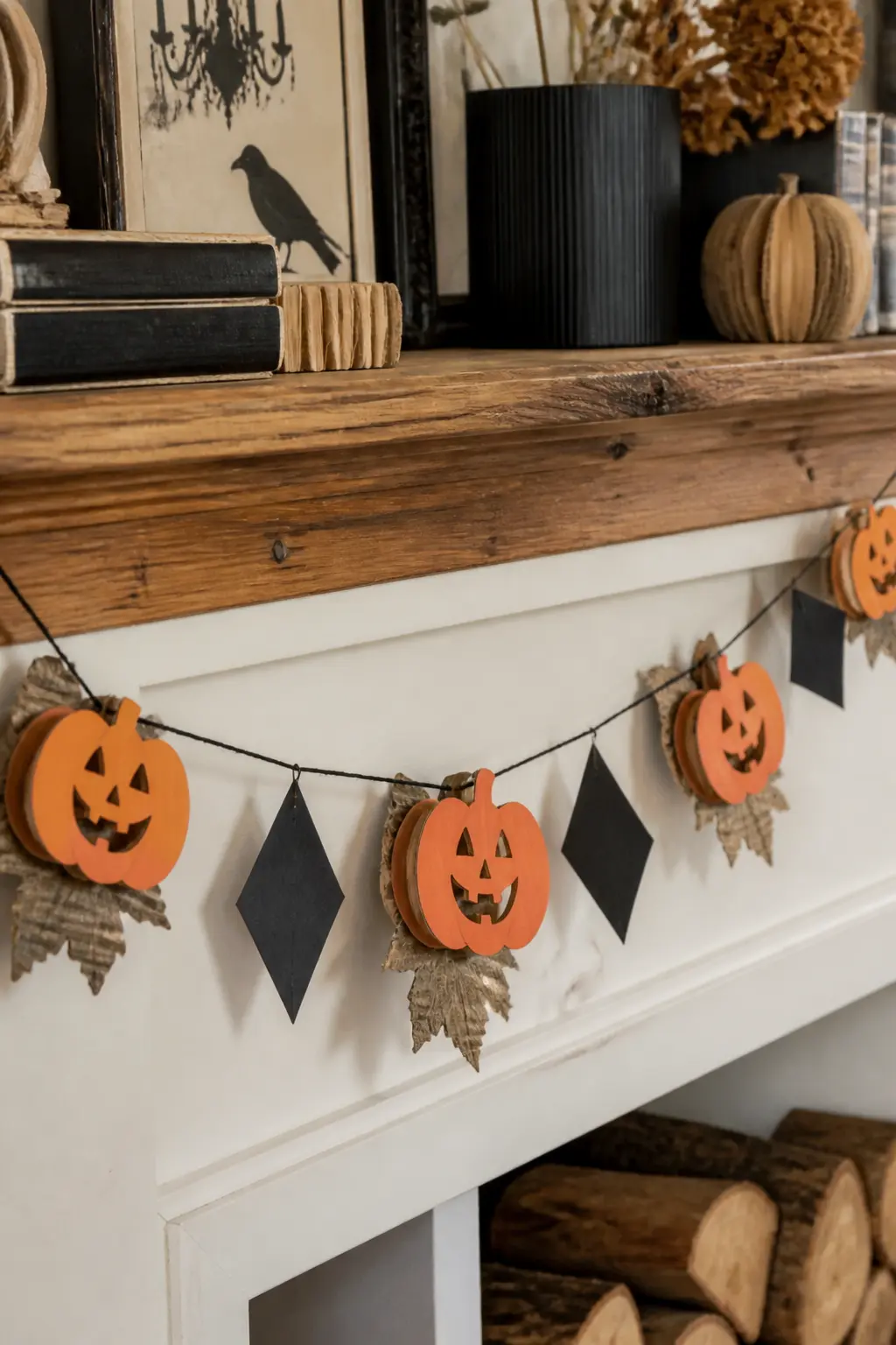 Stacked Pumpkin Garland Tags — Cut small pumpkin shapes from orange and rust-coloured card stock, punch a hole at the top, and string them on black twine