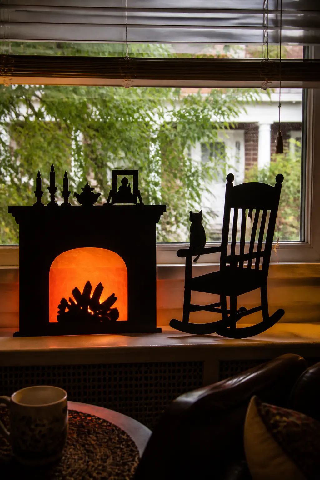 Rocking Chair by the Fire — Cut a rocking chair with an exaggerated curved rocker and a high pointed back. Diy halloween window silhouettes