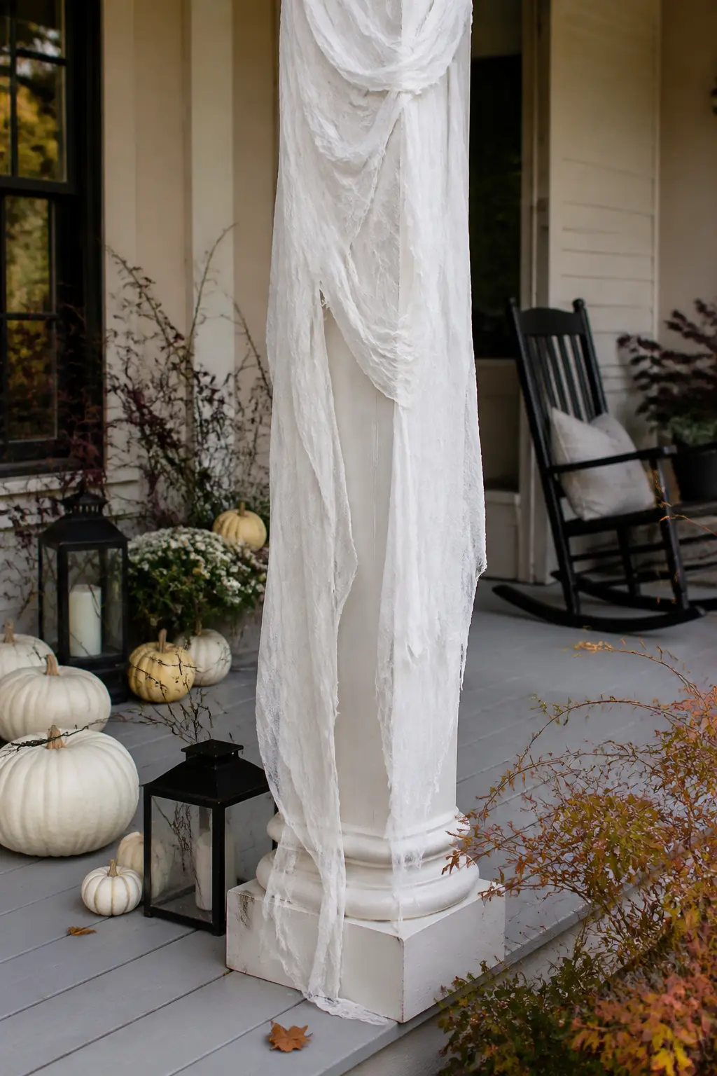 Torn Muslin Draped over One Porch Column