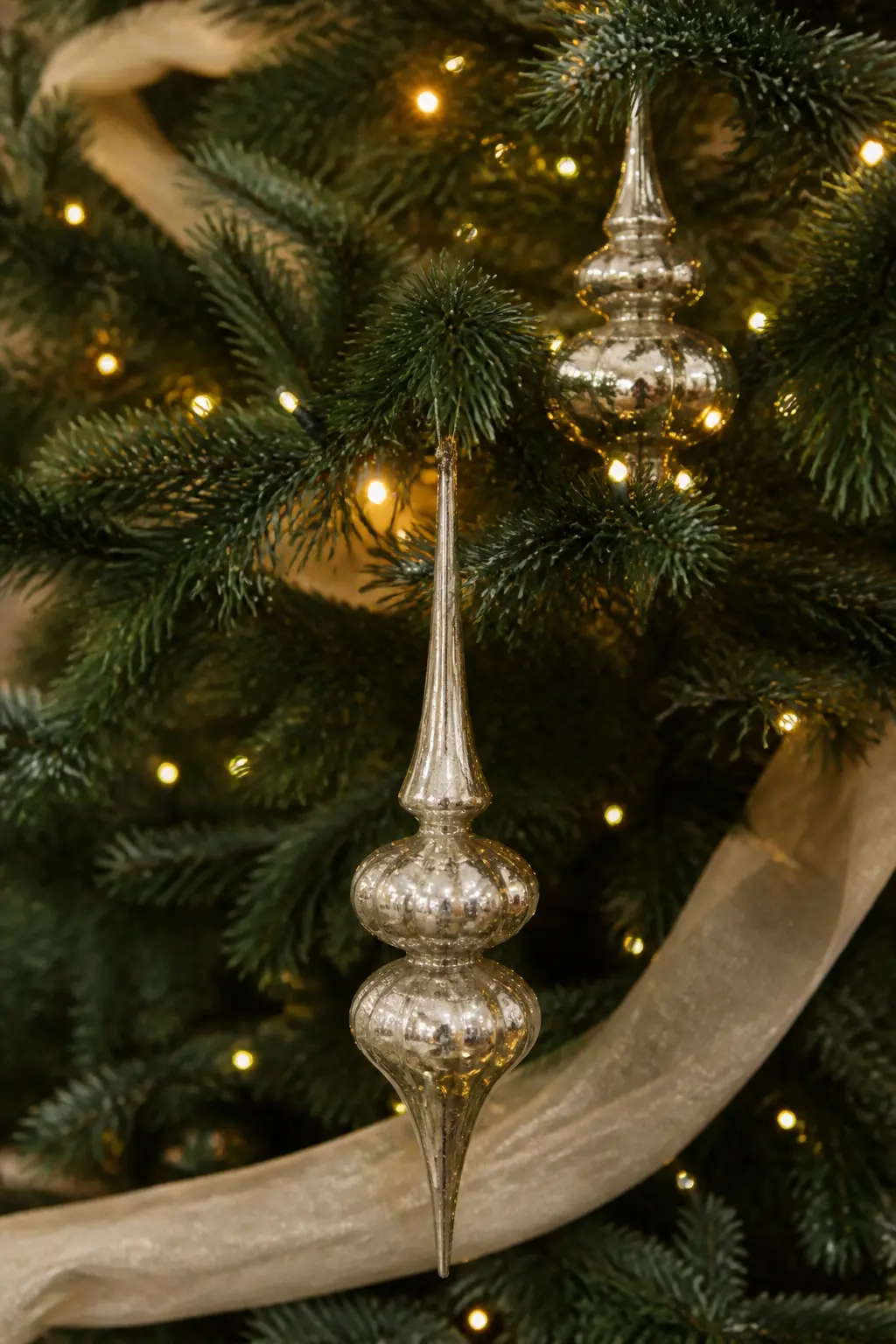 Mercury Glass Finials as the Only Shiny Element — Use mercury glass finials, the long teardrop-shaped ornaments, as the only reflective element on an otherwise