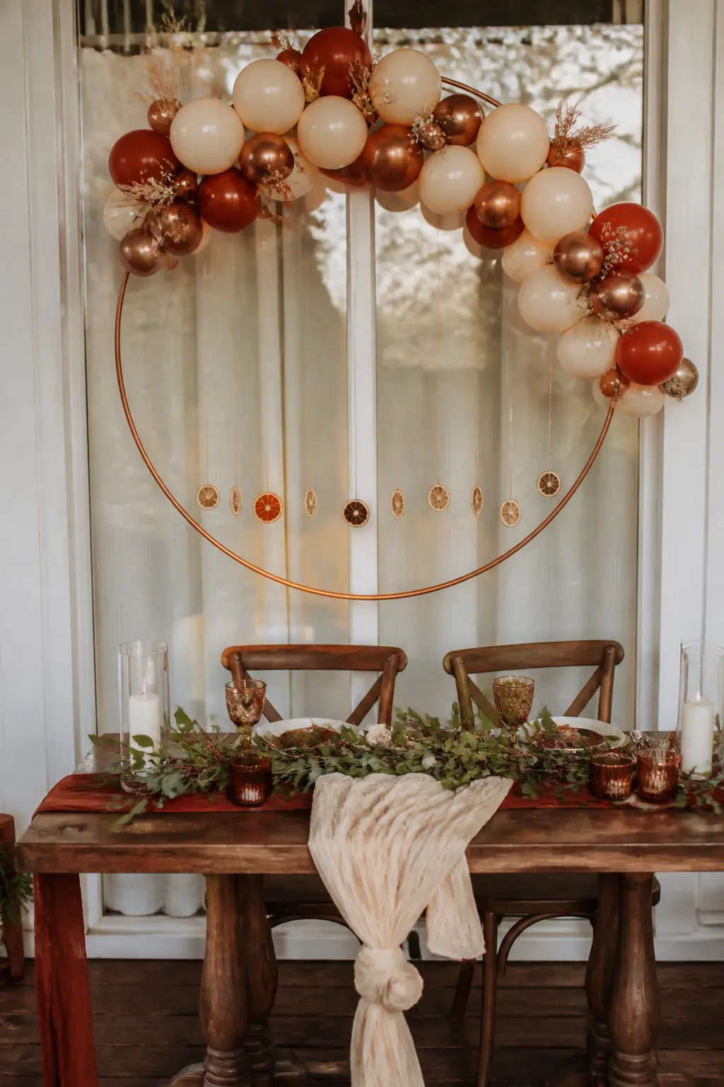 Rust, Cream and Copper Hoop Above a Sweetheart Table at an Autumn Wedding — Suspend a 24-inch or 30-inch embroidery hoop, sprayed copper, above a sweetheart